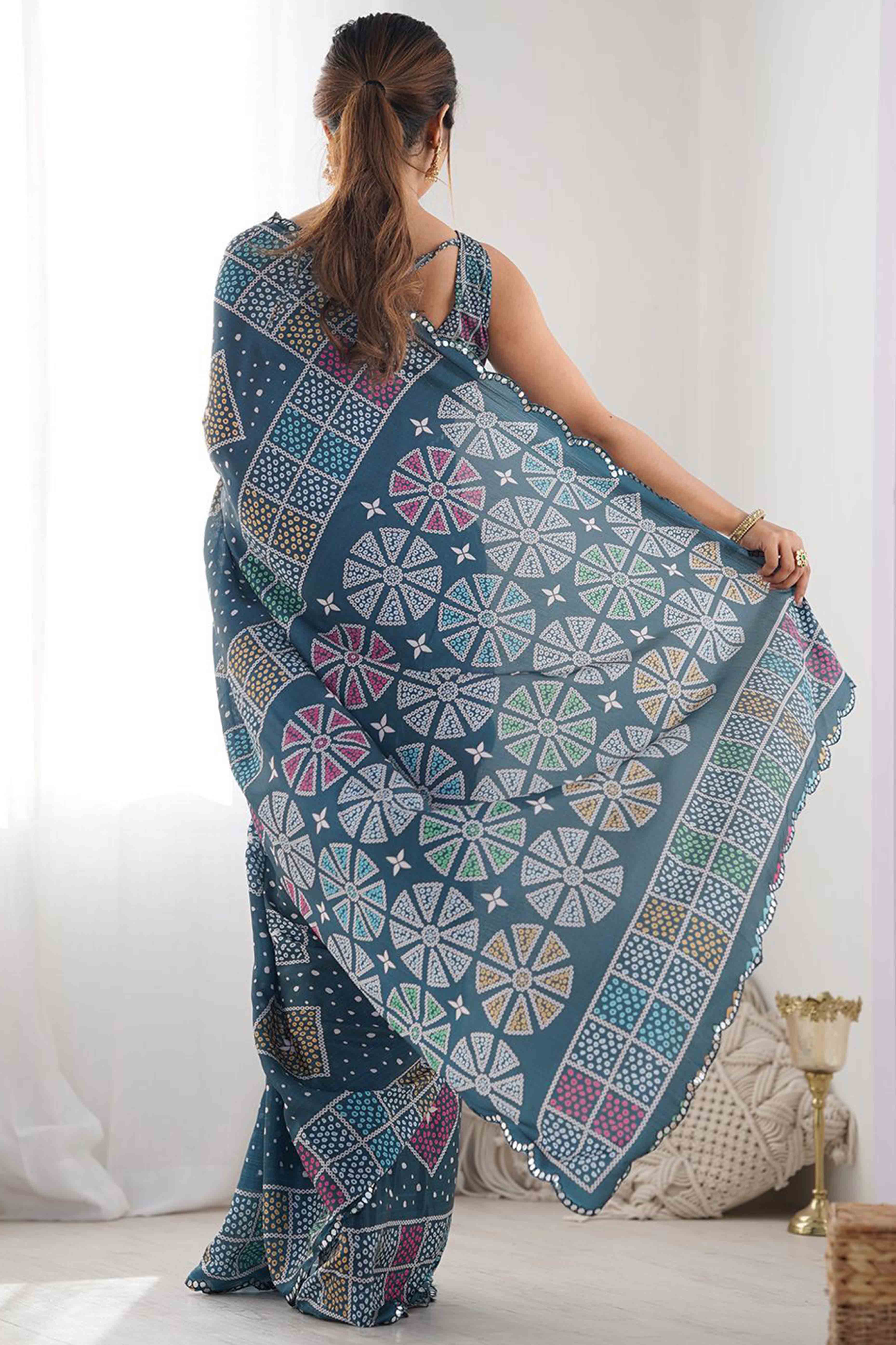 Morpich Blue Bandhani Digital Print Georgette Saree Enhanced With A Sparkling Lace Border