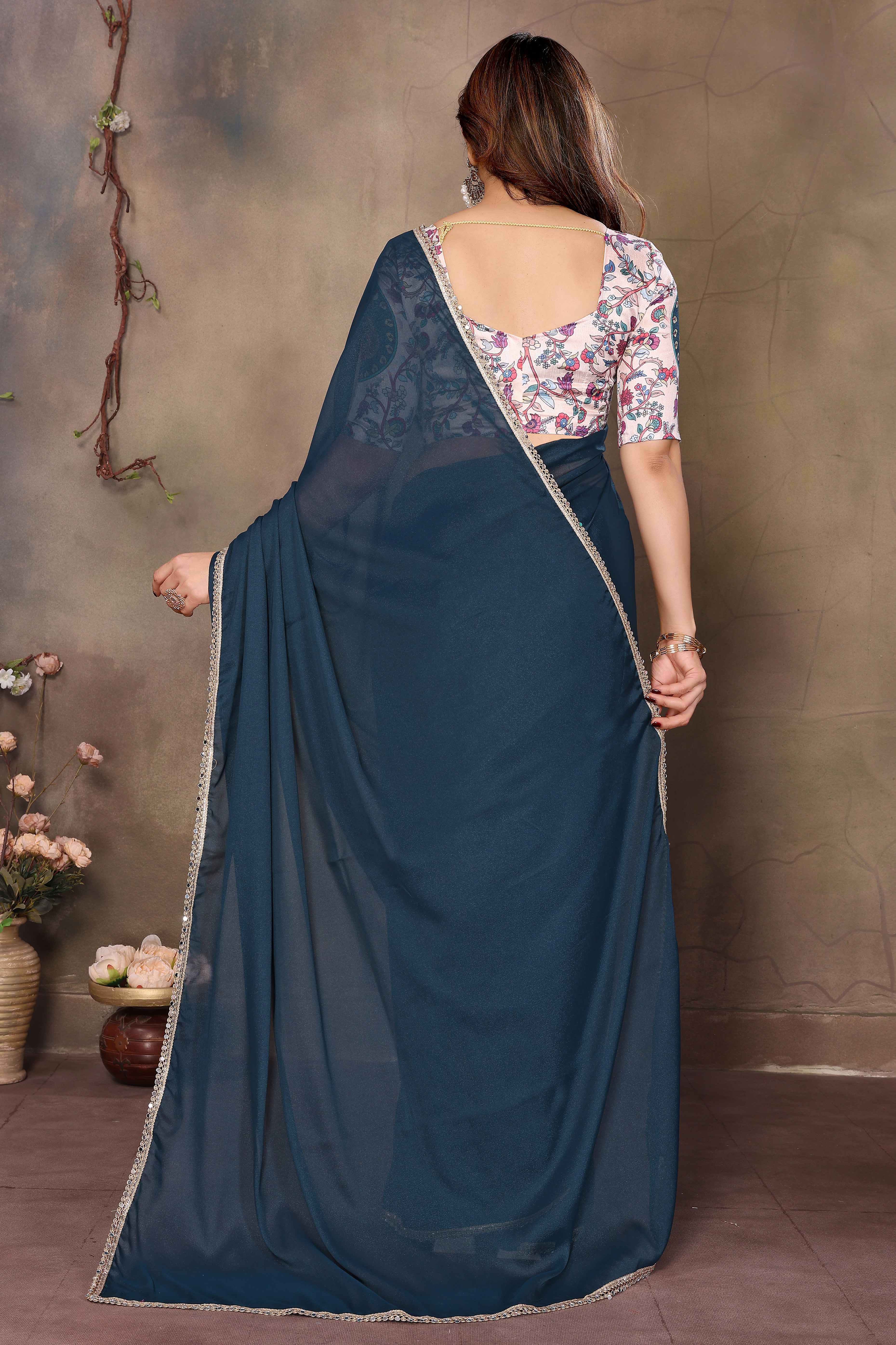 Morpich Blue Solid Sparkling Georgette Saree Enhanced With Shimmering Mirror Border