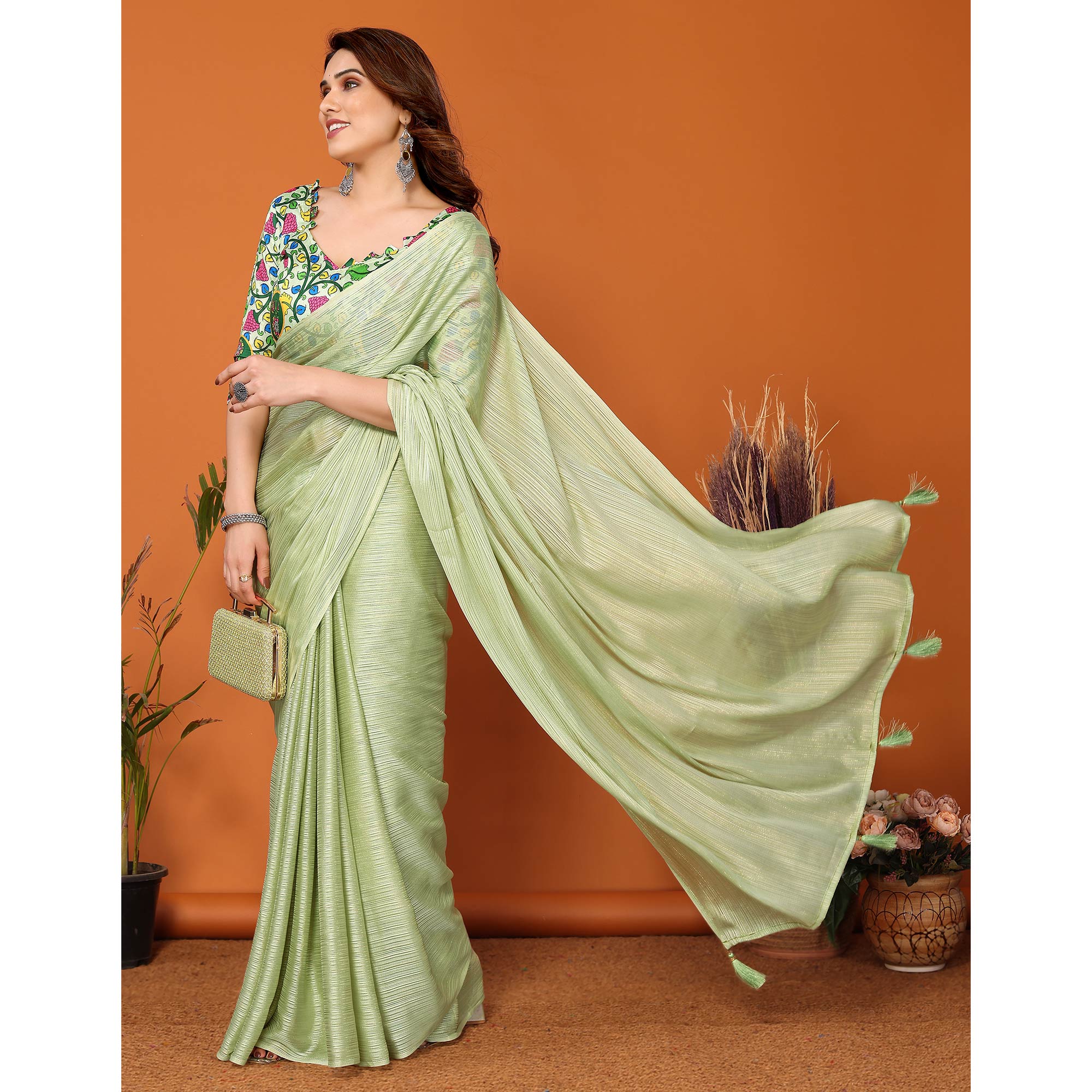 Pista Green Woven Satin Saree With Tassels