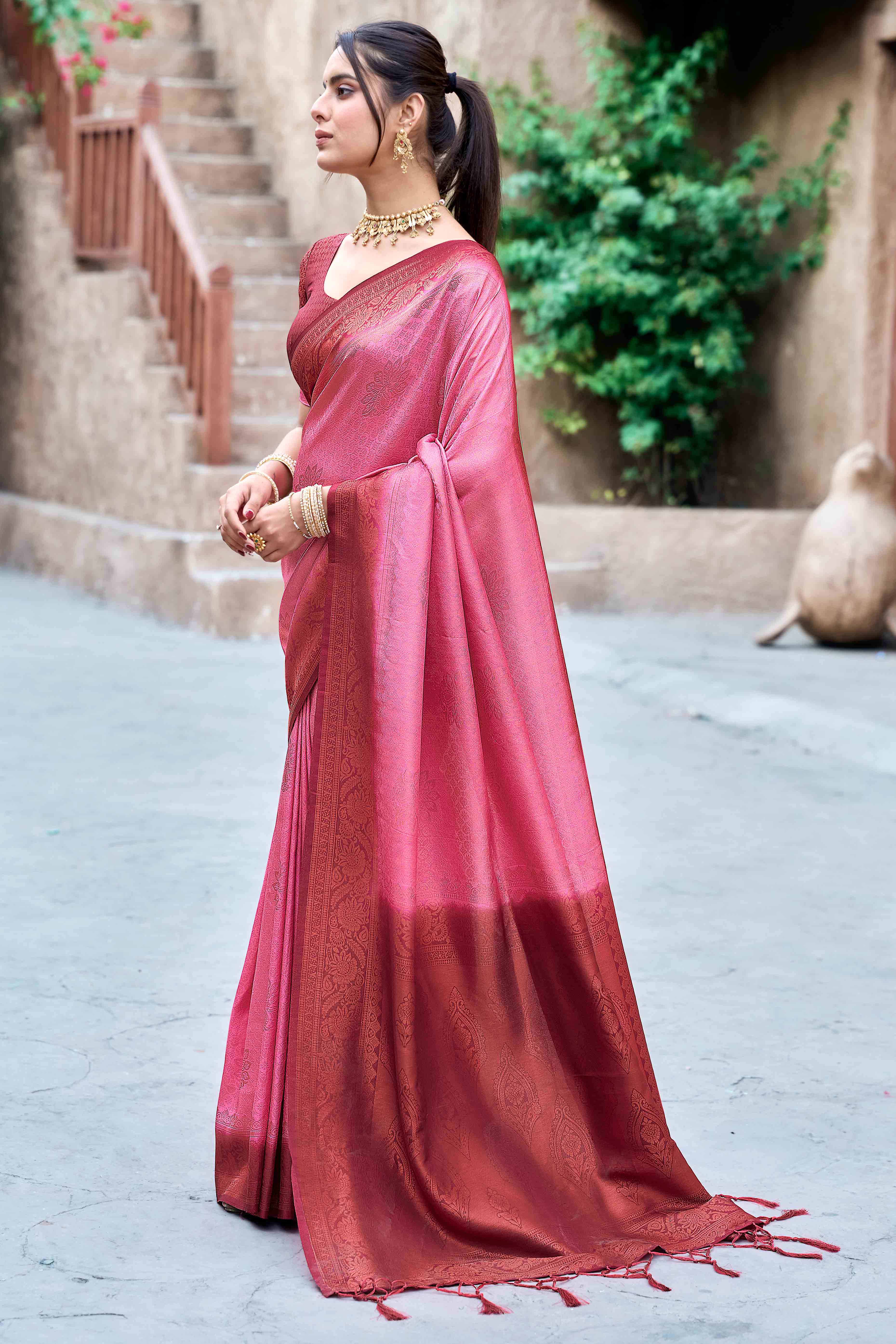 Gajari Pink Banarasi Silk Saree Featuring Elegant Floral Woven & Delicate Tassel Edging