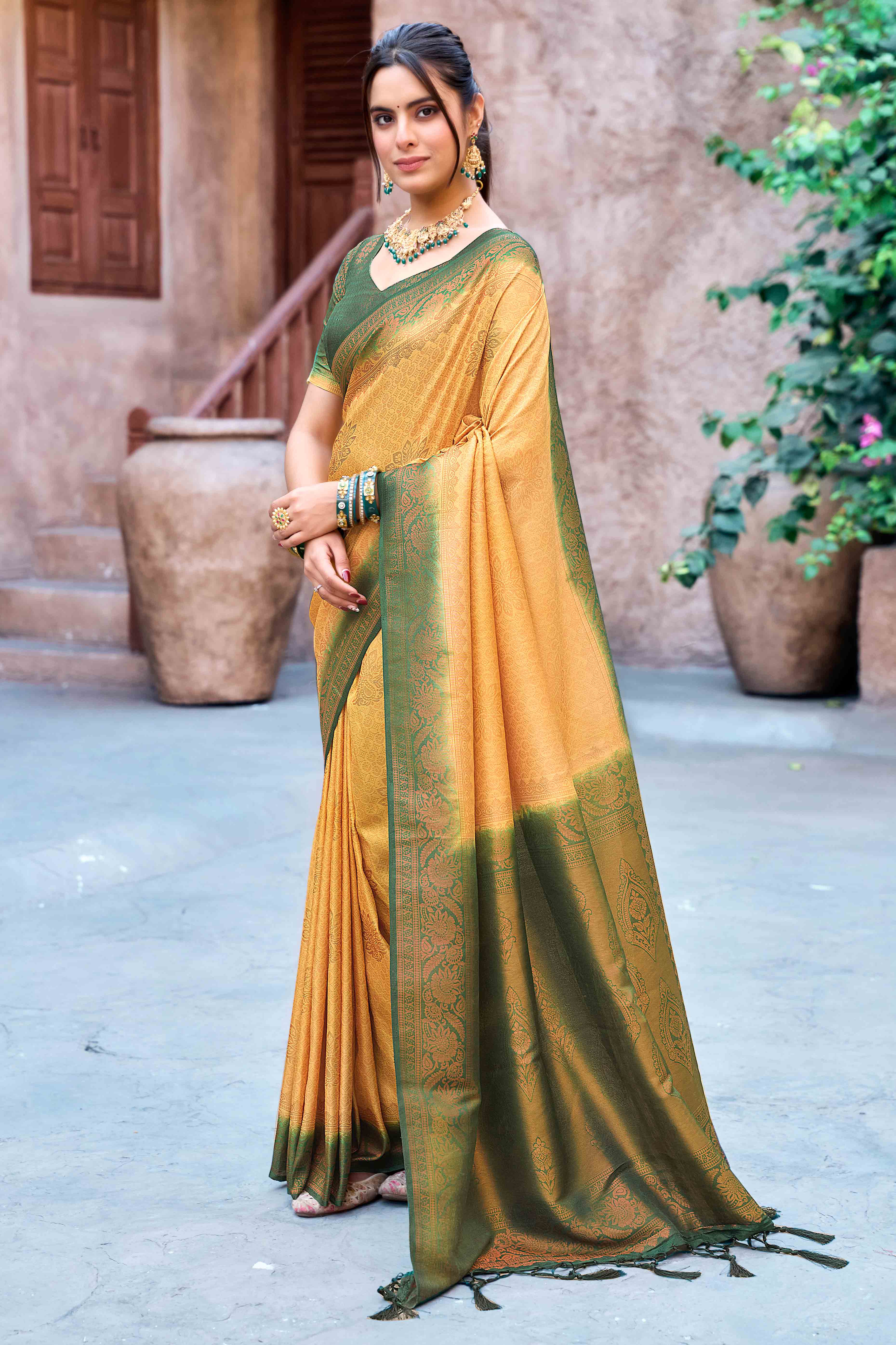 Mustard Banarasi Silk Saree Featuring Elegant Floral Woven & Delicate Tassel Edging