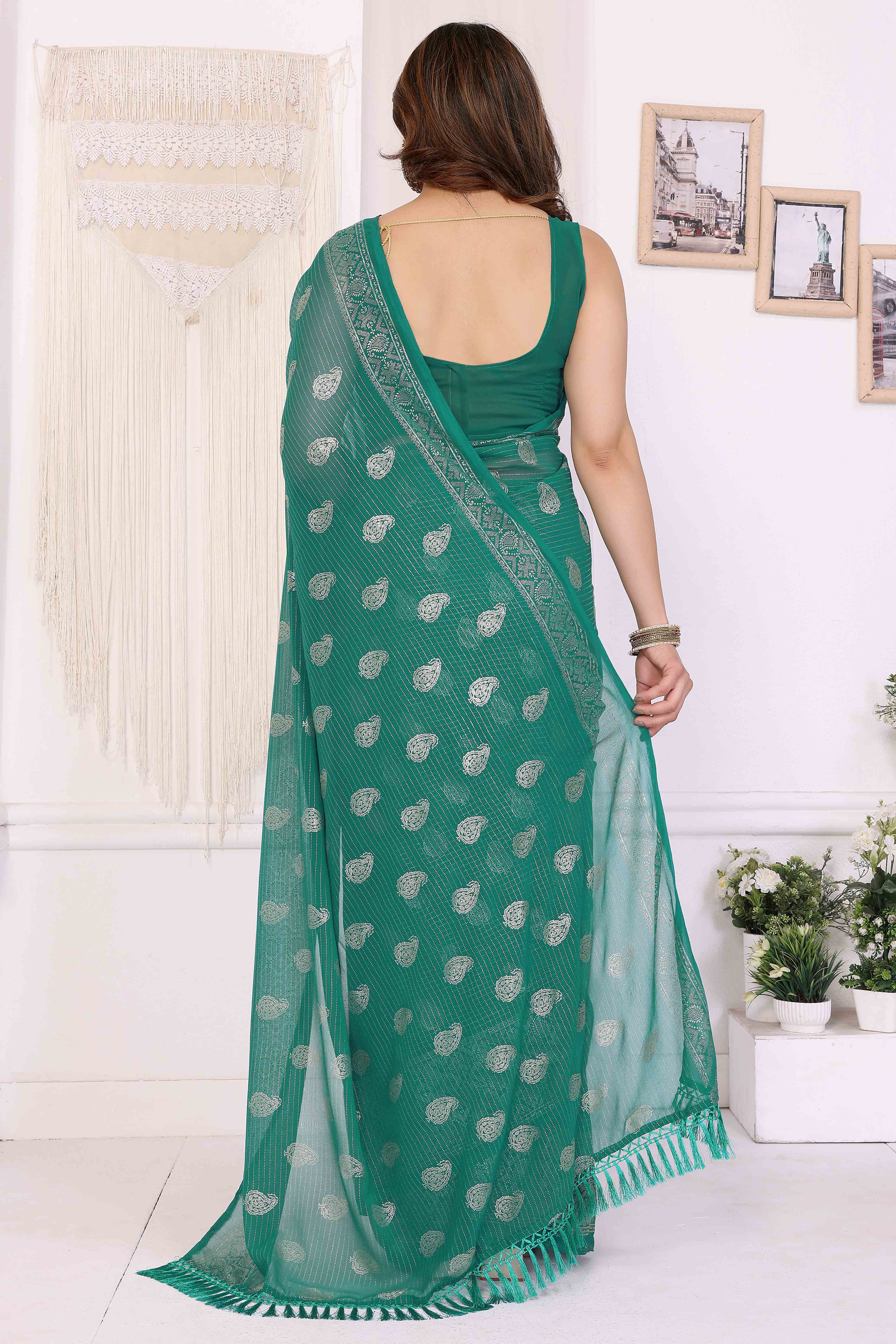 Rama Green Foil Printed Georgette Saree Enhanced With Delicate Lace Border & Elegant Tassel
