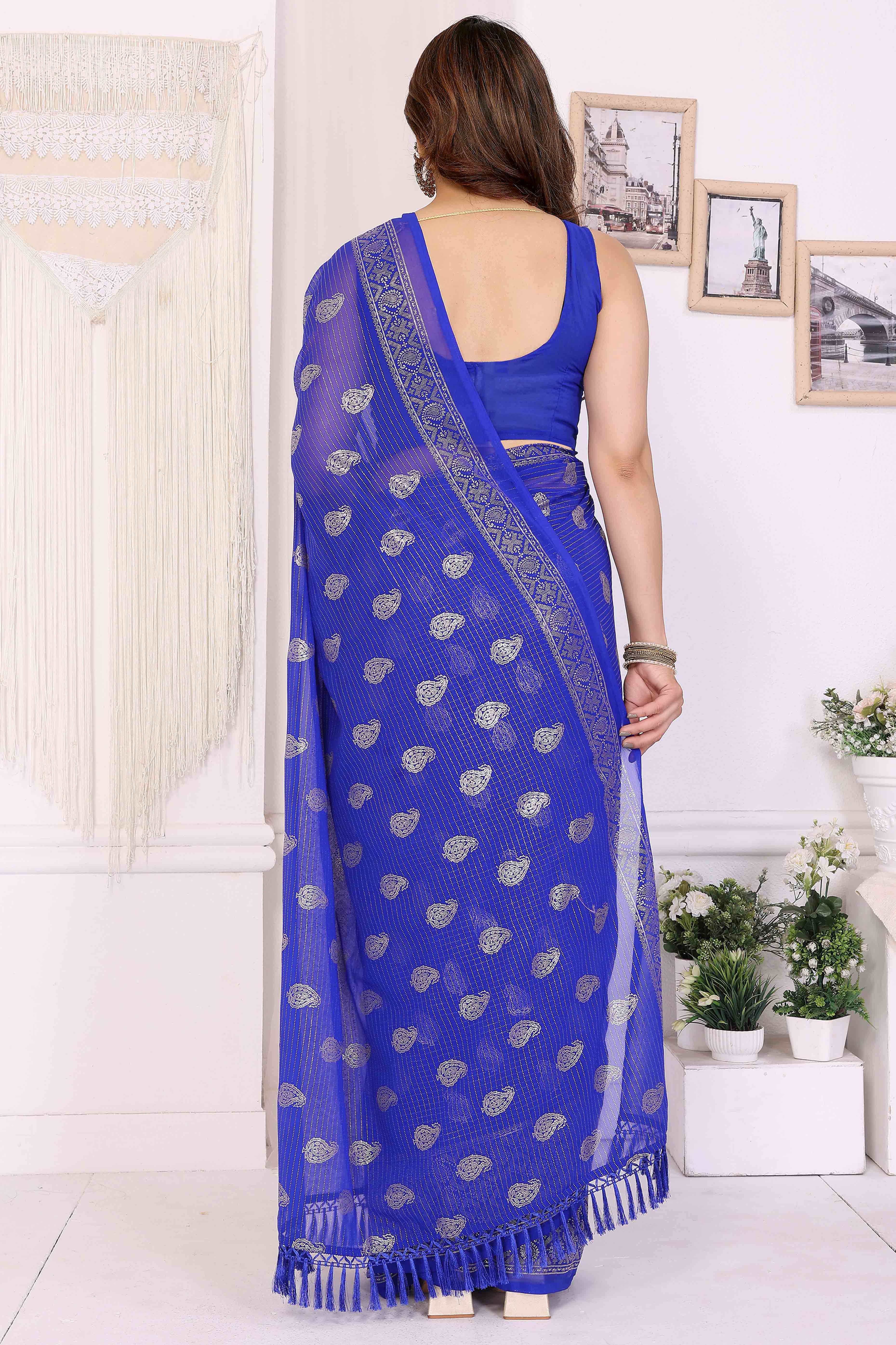 Royal Blue Foil Printed Georgette Saree Enhanced With Delicate Lace Border & Elegant Tassel