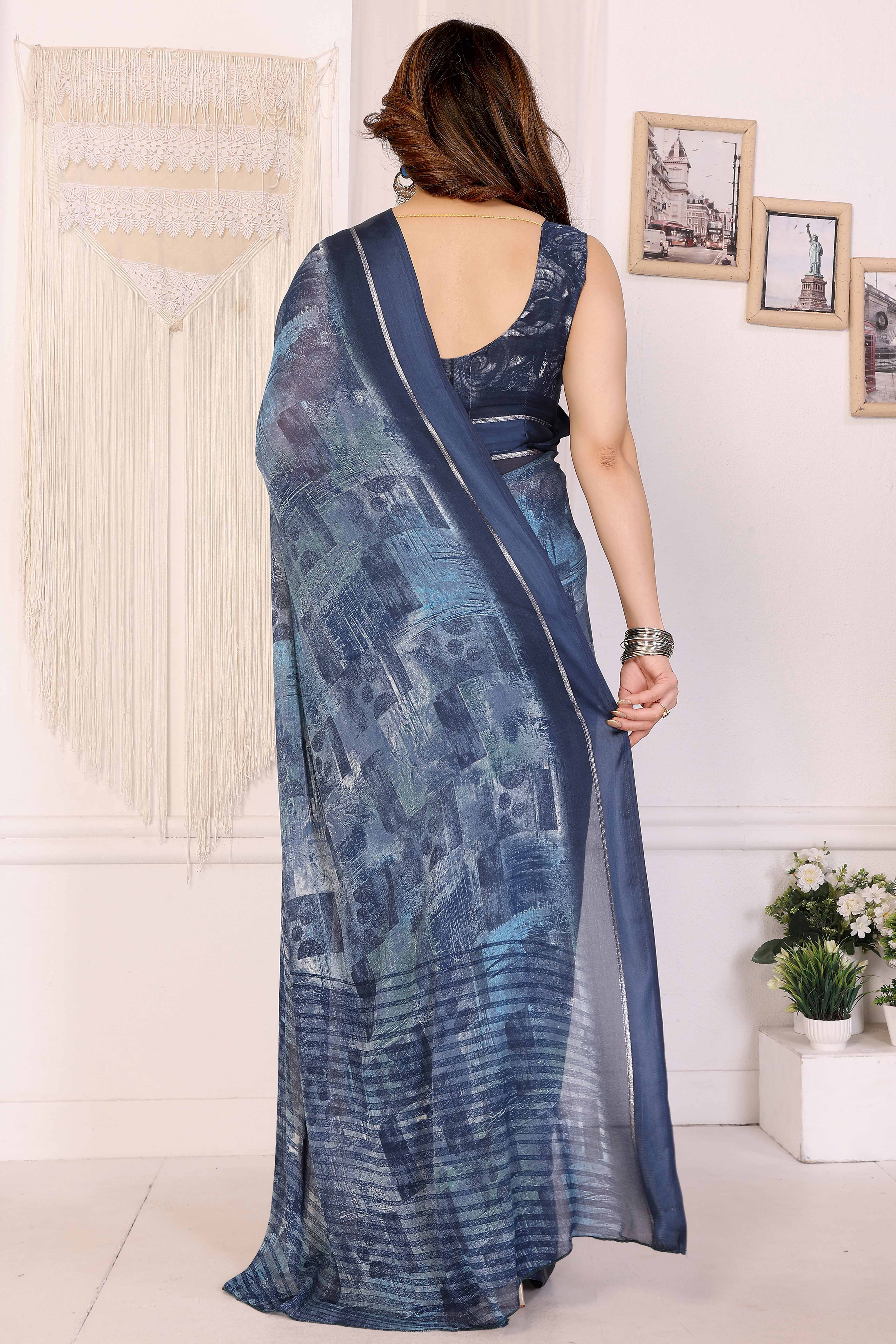 Trendy Blue Moss Crepe Saree with Floral Motifs and Satin Border