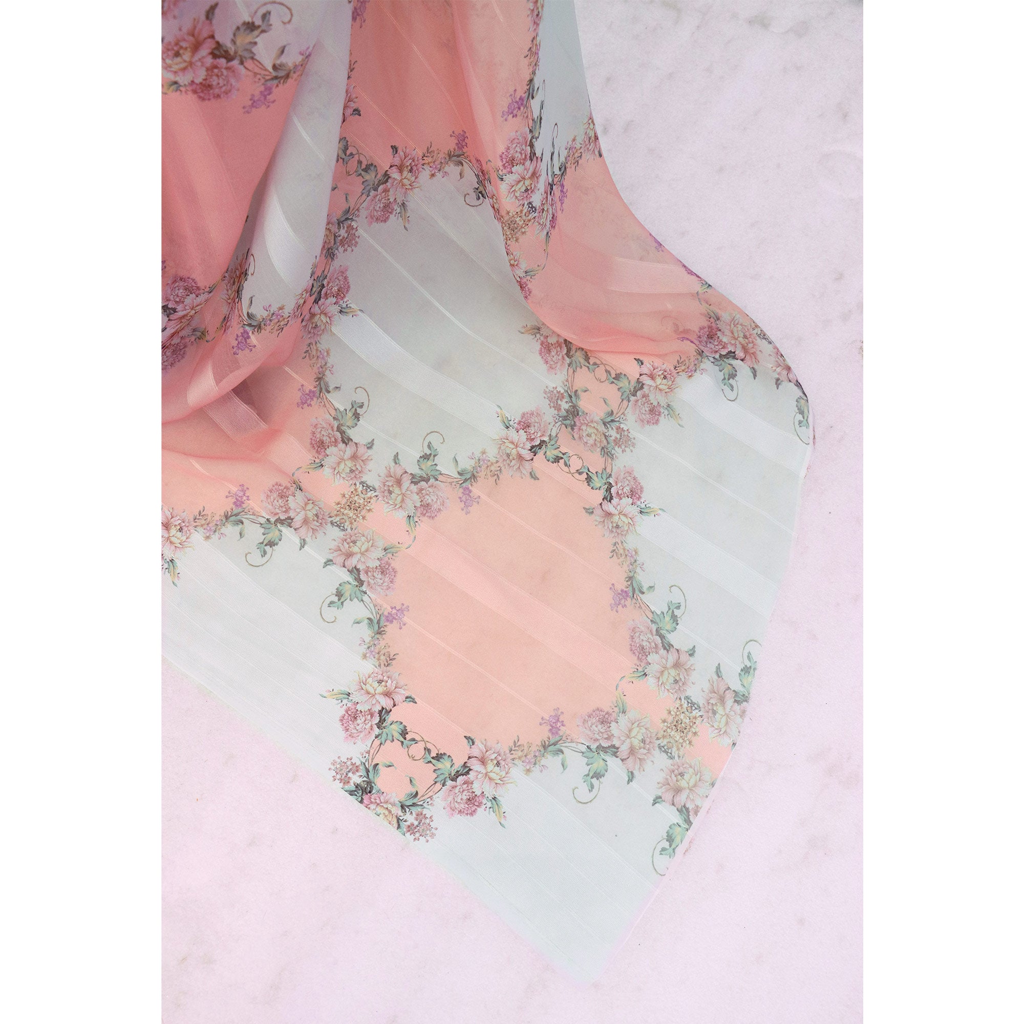 White & Peach Bloom Floral Digital Printed Georgette Saree Accentuated With Graceful Zari Stripes