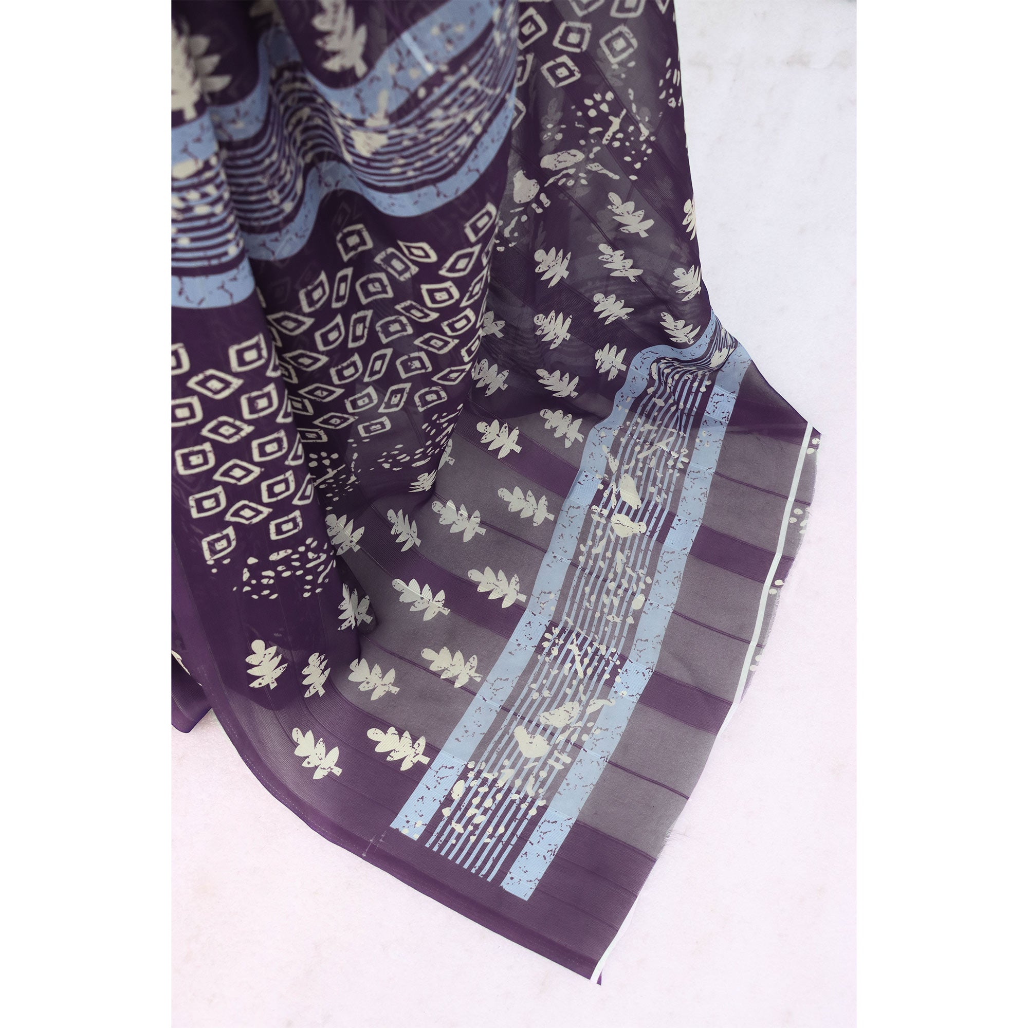 Charming Purple Geometric Digital Printed Georgette Saree Accentuated With Zari Stripes