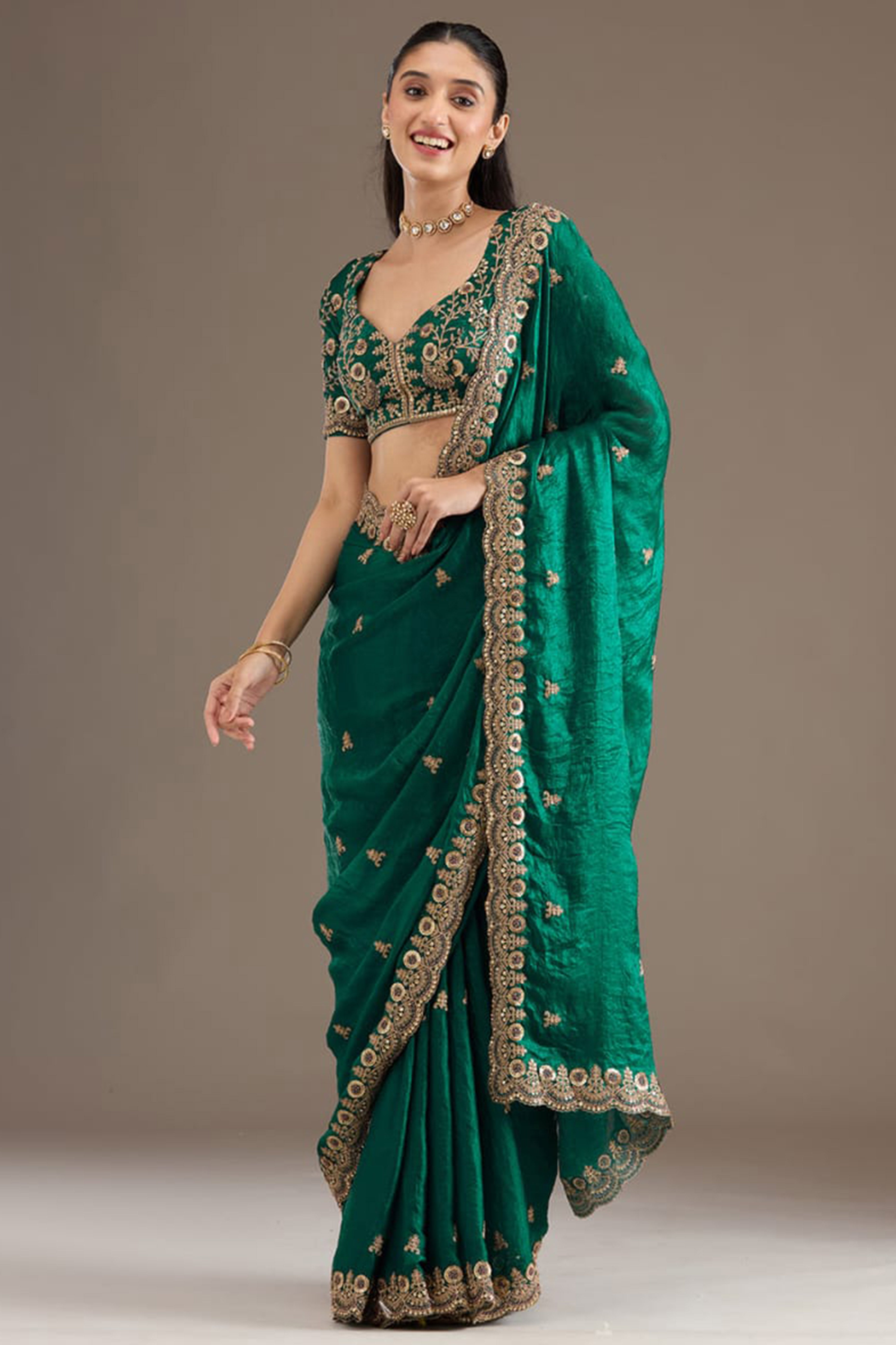 Trendy Green Fancy Satin Saree Enhanced With Rich Golden Embroidered Design