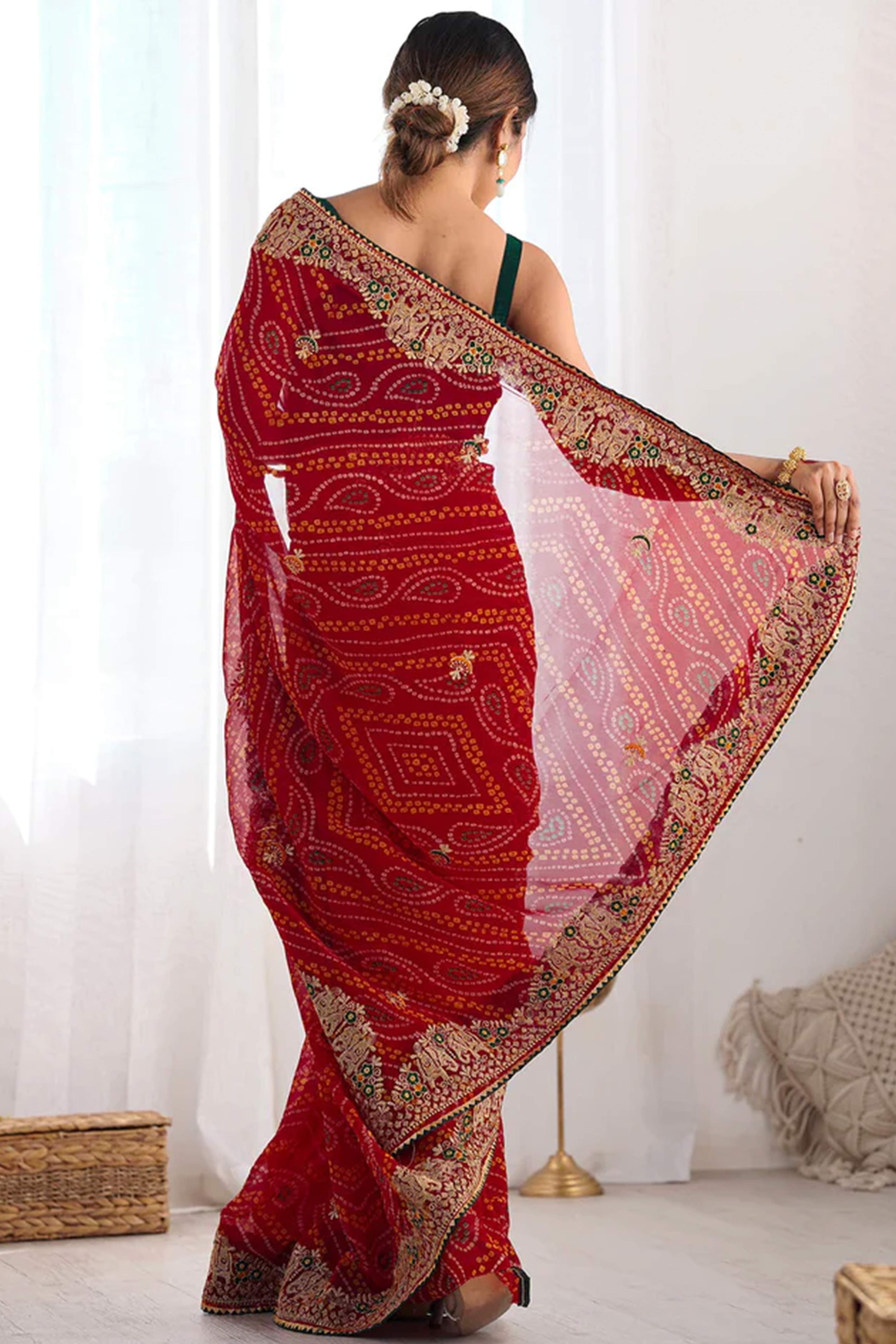 Classic Red Bandhani Print Georgette Saree Enhanced With Intricate Zari Embroidered Border Detailing