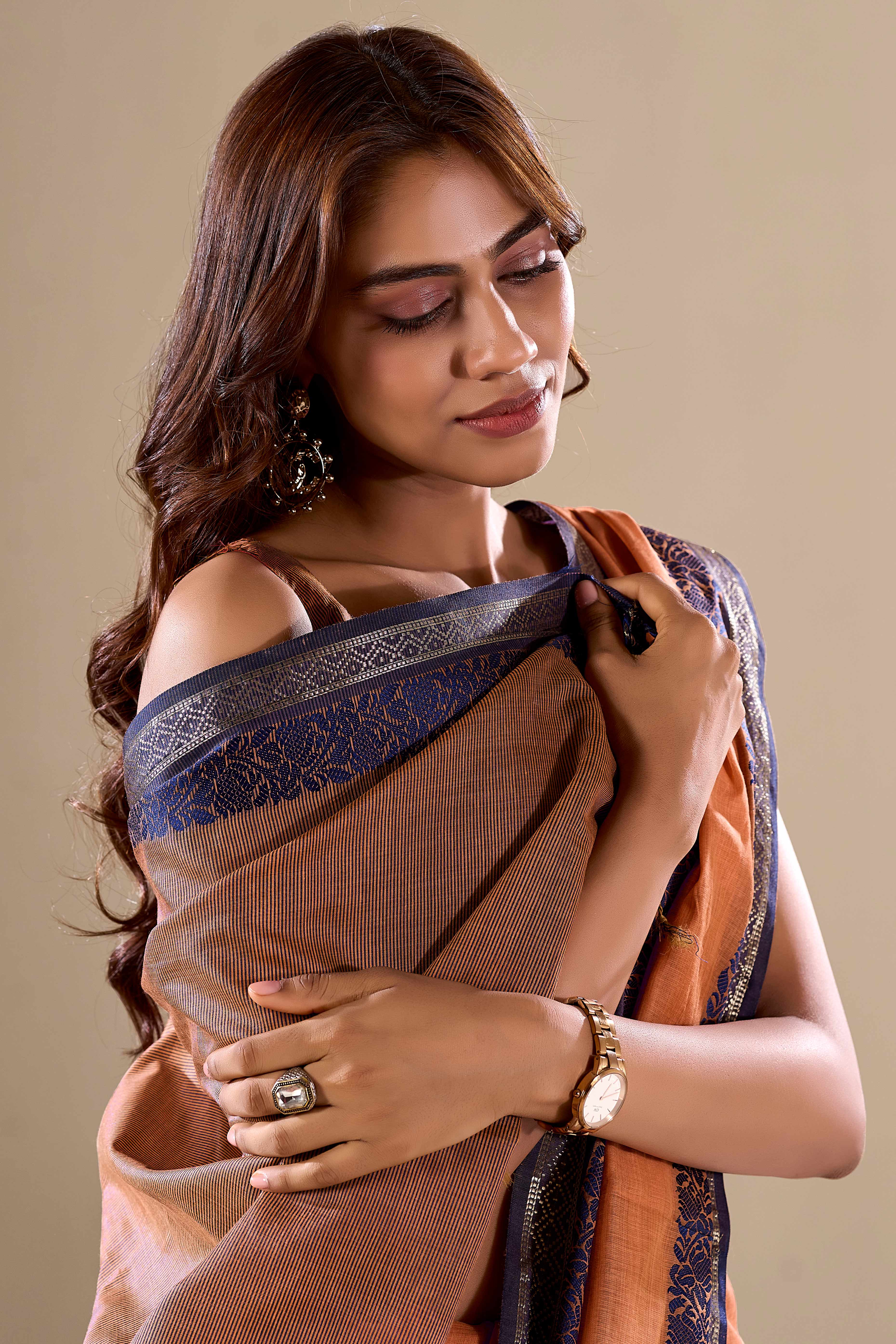 Orange Khaadi Saree with Elegant Solid Body and Contrast Weaving Border