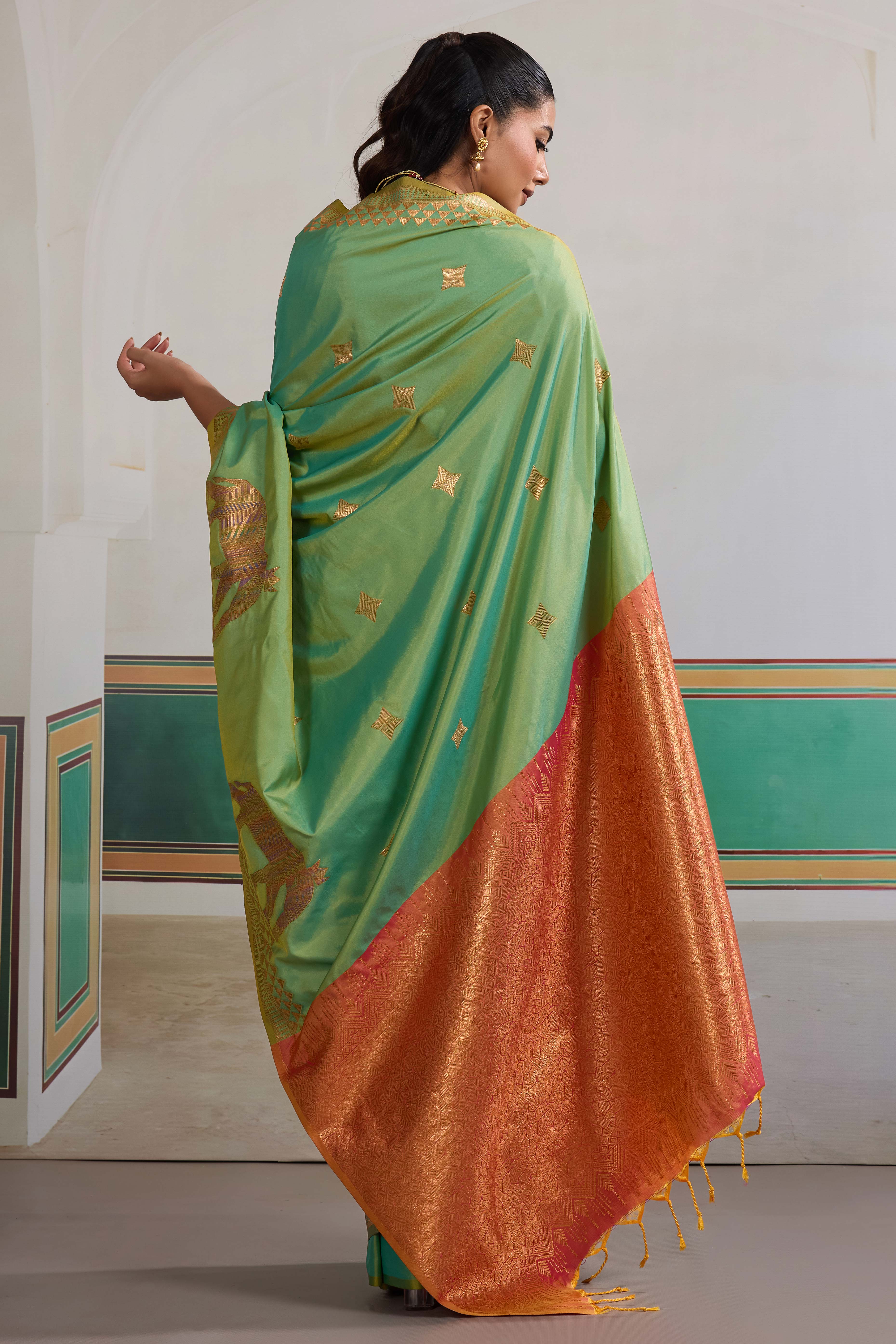 Traditional Green Pure Silk Saree Featuring Elephant Motif Zari Weaving & Tassel Pallu