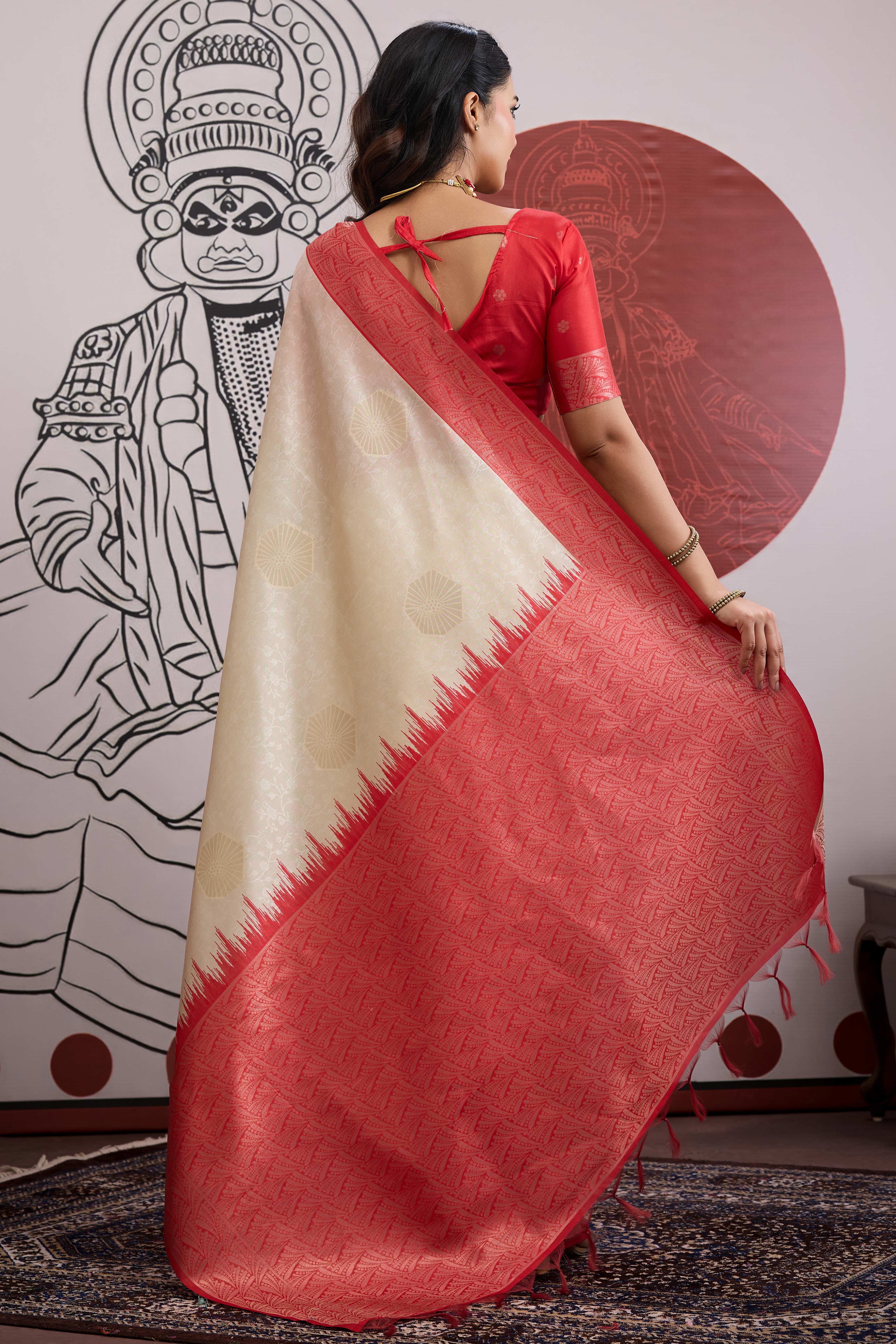 Graceful Cream & Red Zari Weaving Silk Saree Highlighted By Decorative Tassel Pallu