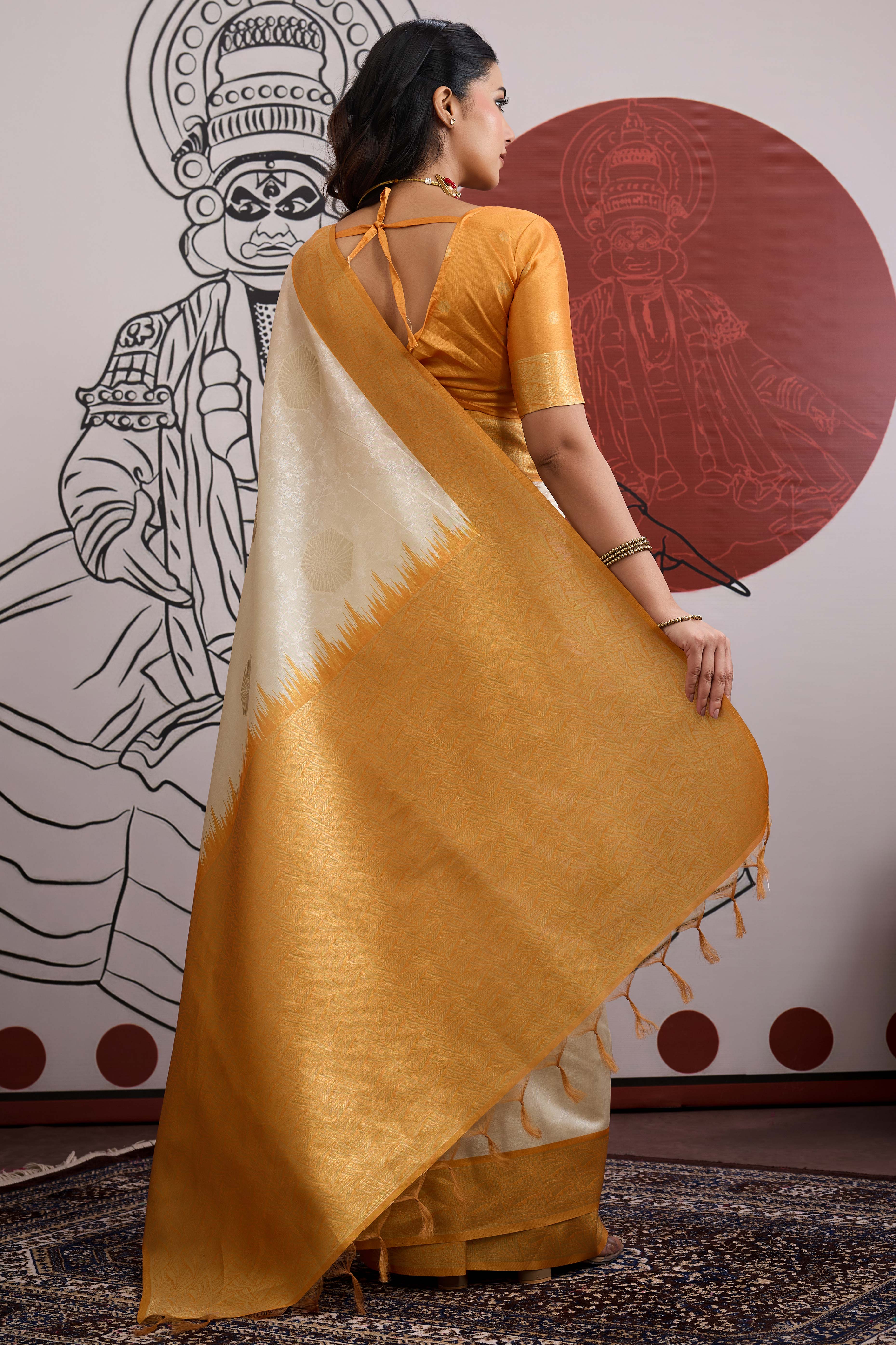 Graceful Cream & Mustard Zari Weaving Silk Saree Highlighted By Decorative Tassel Pallu