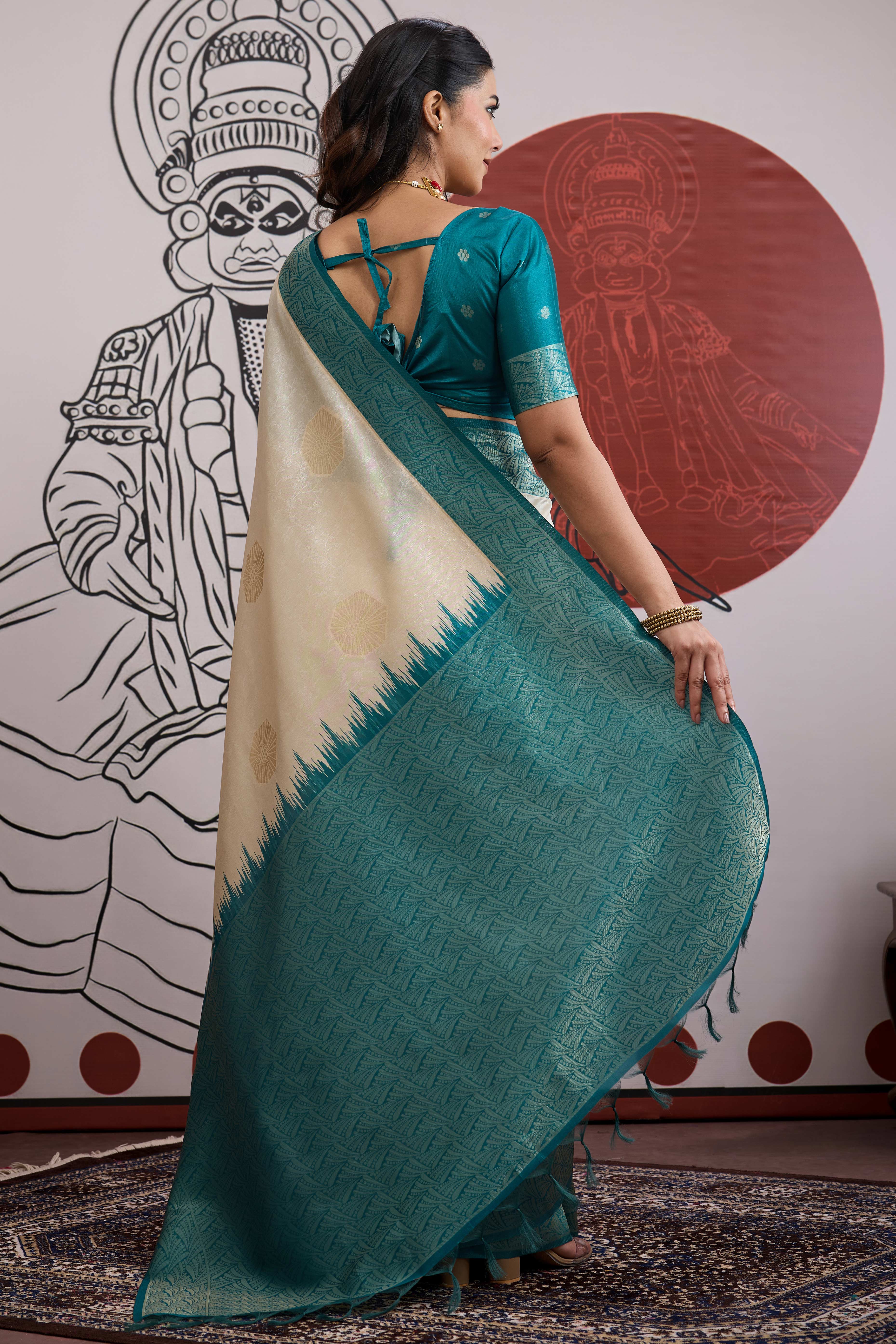 Graceful Cream & Teal Zari Weaving Silk Saree Highlighted By Decorative Tassel Pallu