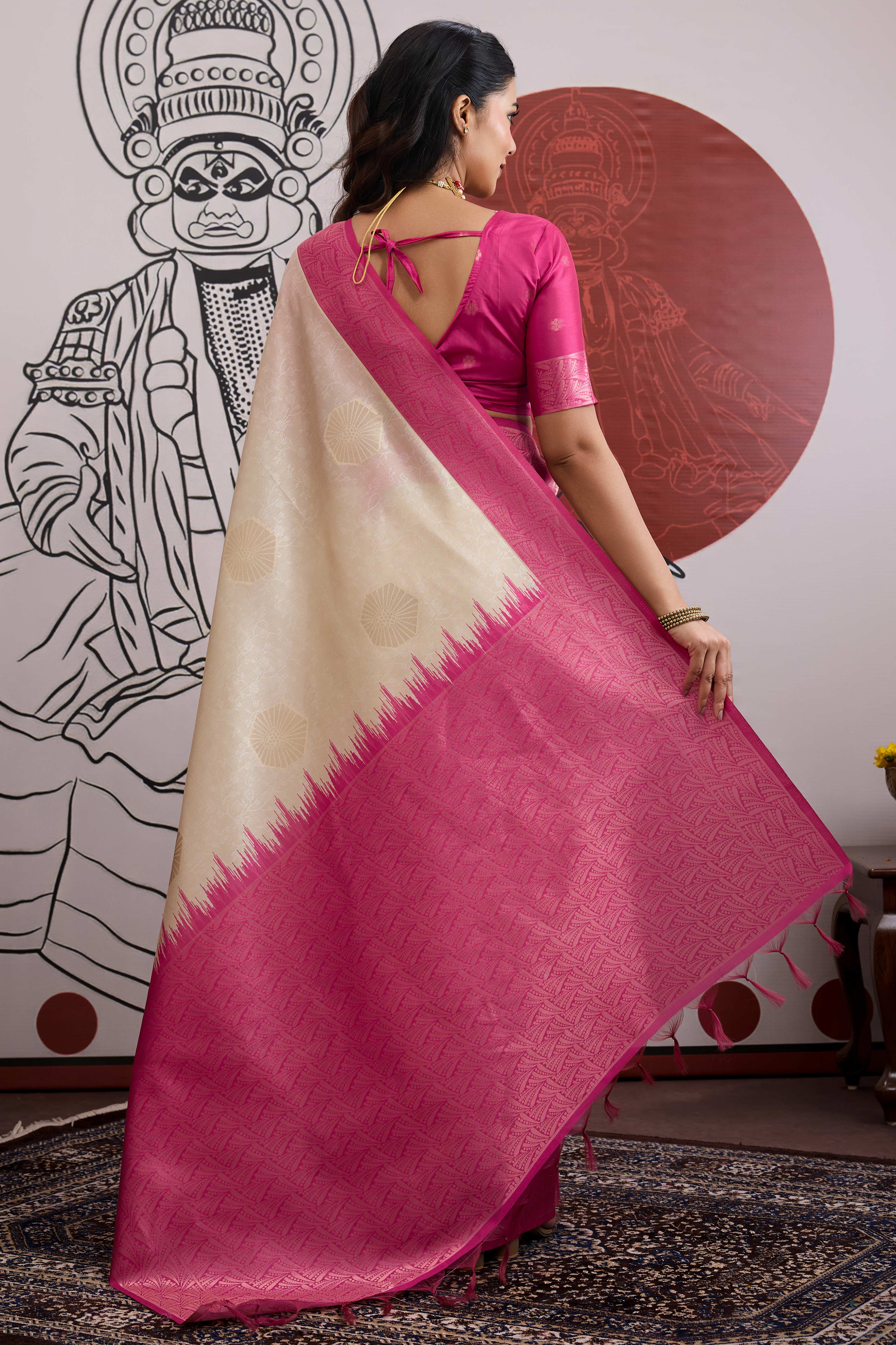Graceful Cream & Pink Zari Weaving Silk Saree Highlighted By Decorative Tassel Pallu