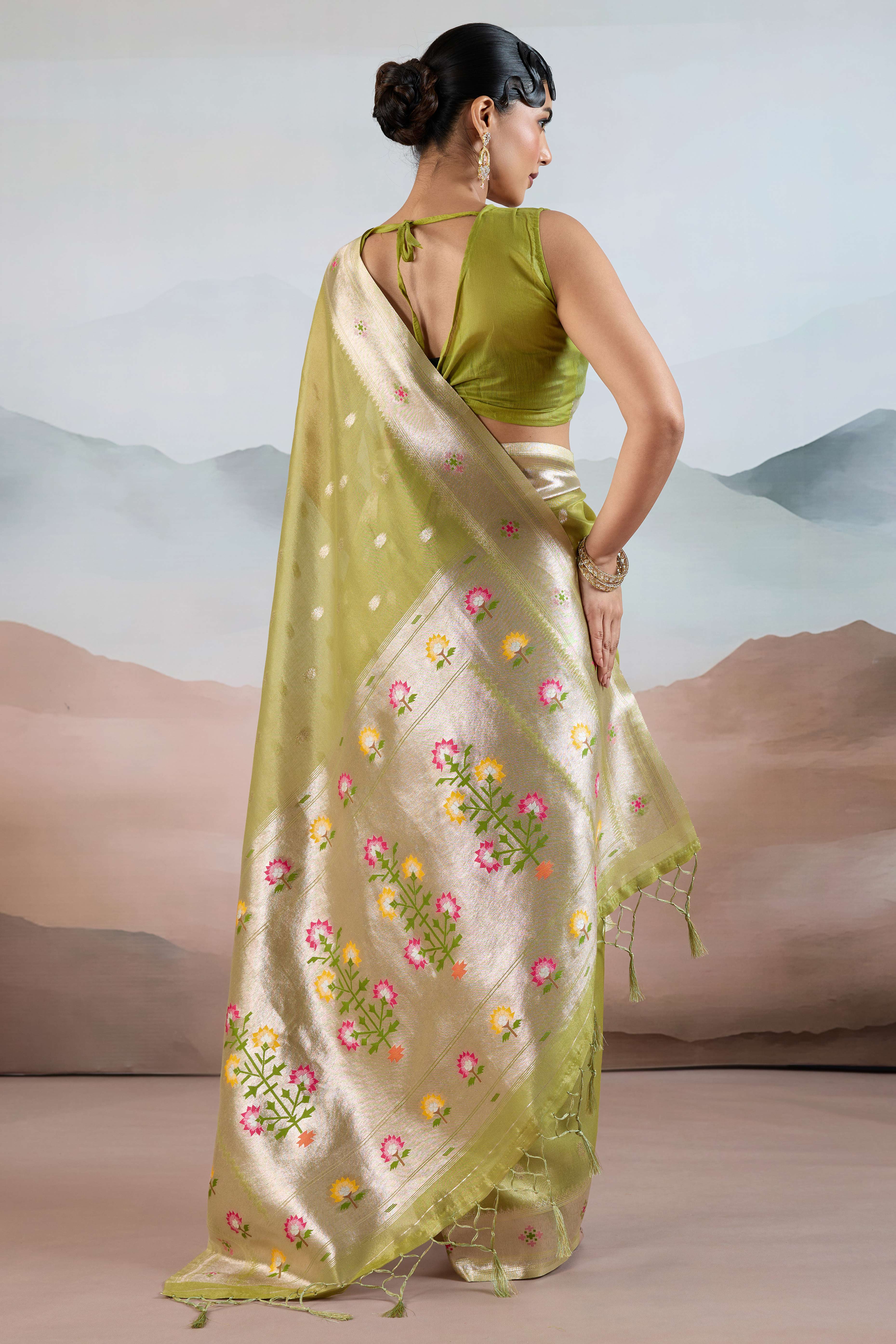 Green Festive Tissue Saree Crafted with Artistic Zari Butti Weaving and a Featherlight Texture