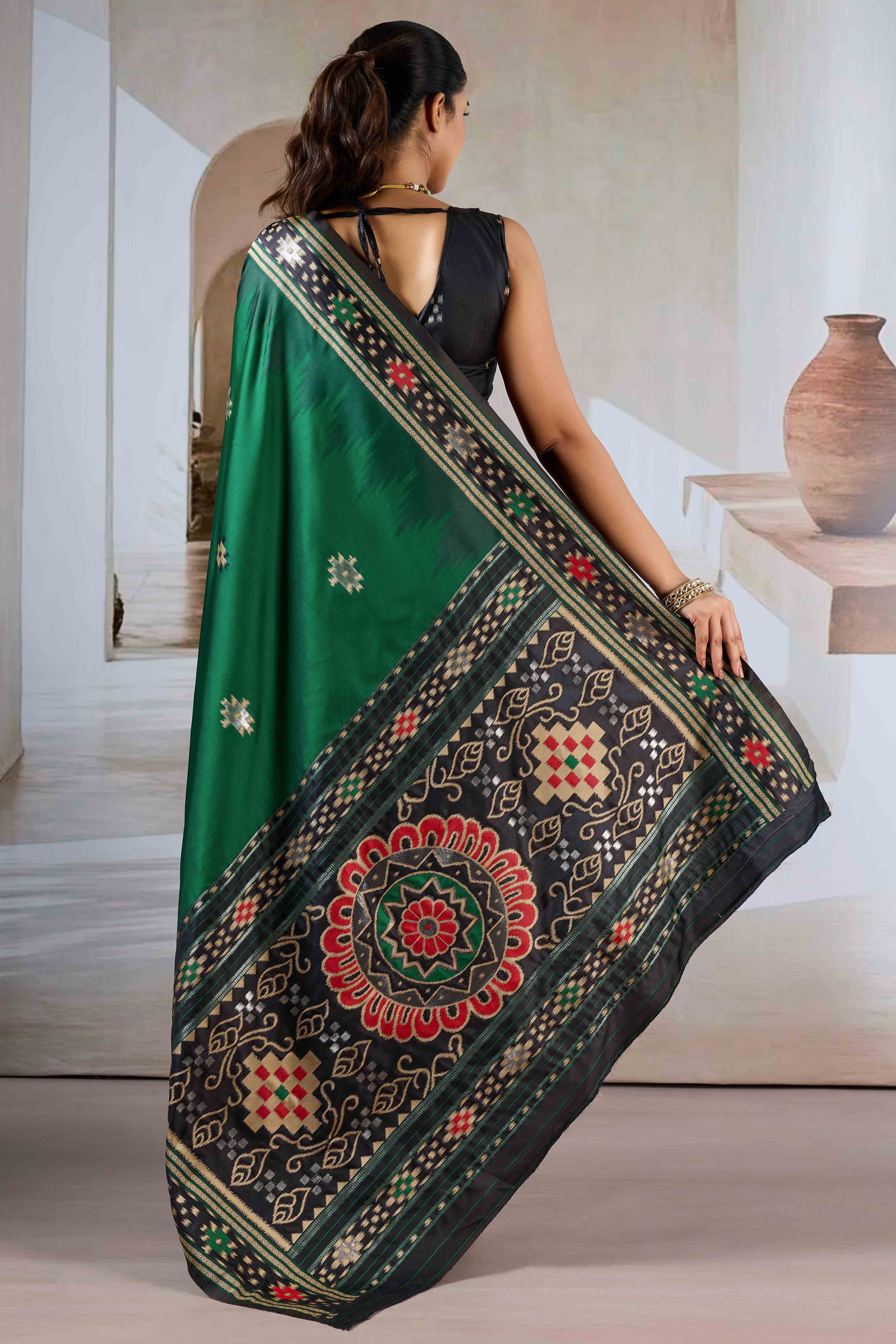 Green Art Silk Saree Adorned with Intricate Patola Style Woven Designs