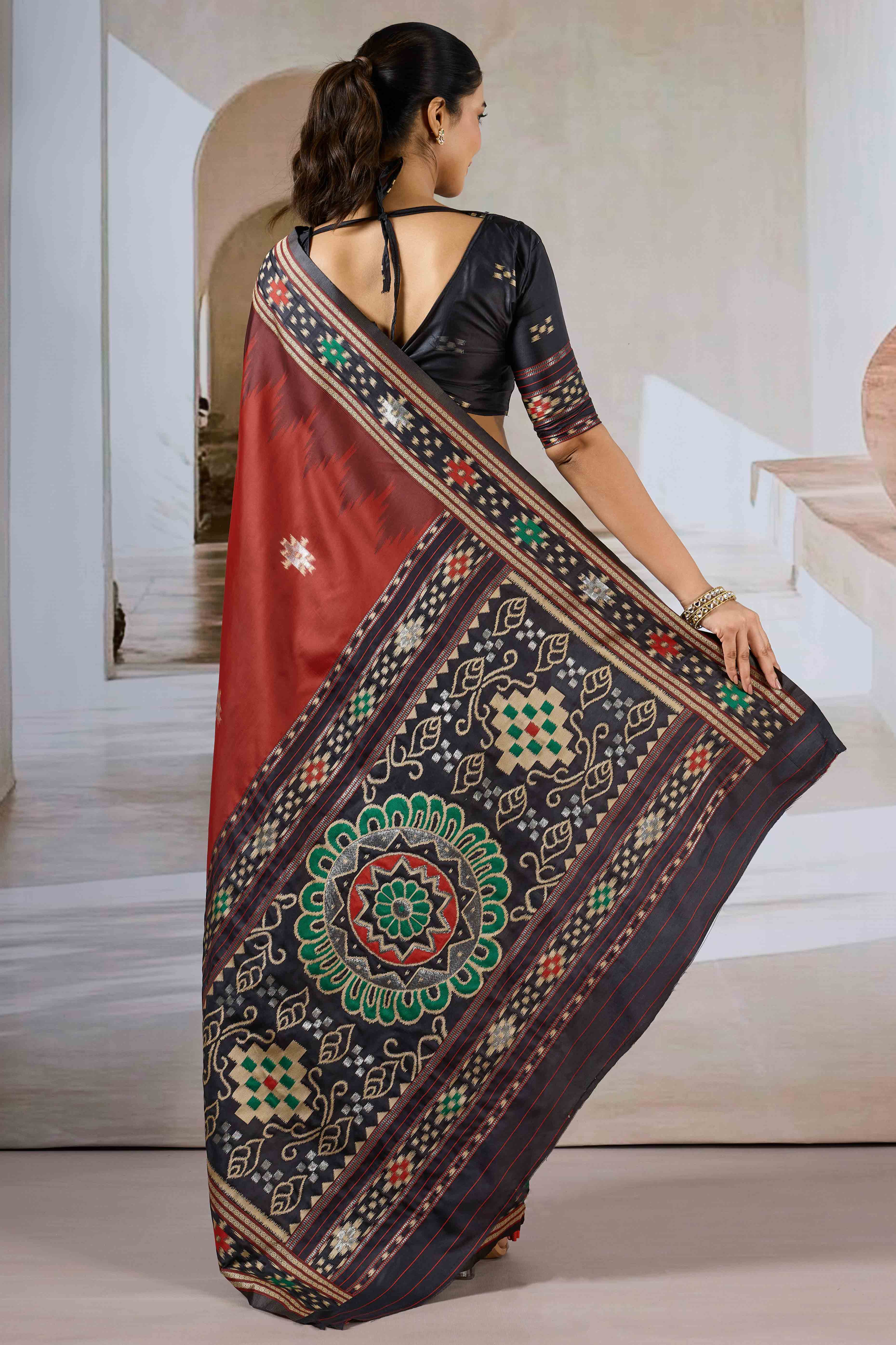 Maroon Art Silk Saree Adorned with Intricate Patola Style Woven Designs