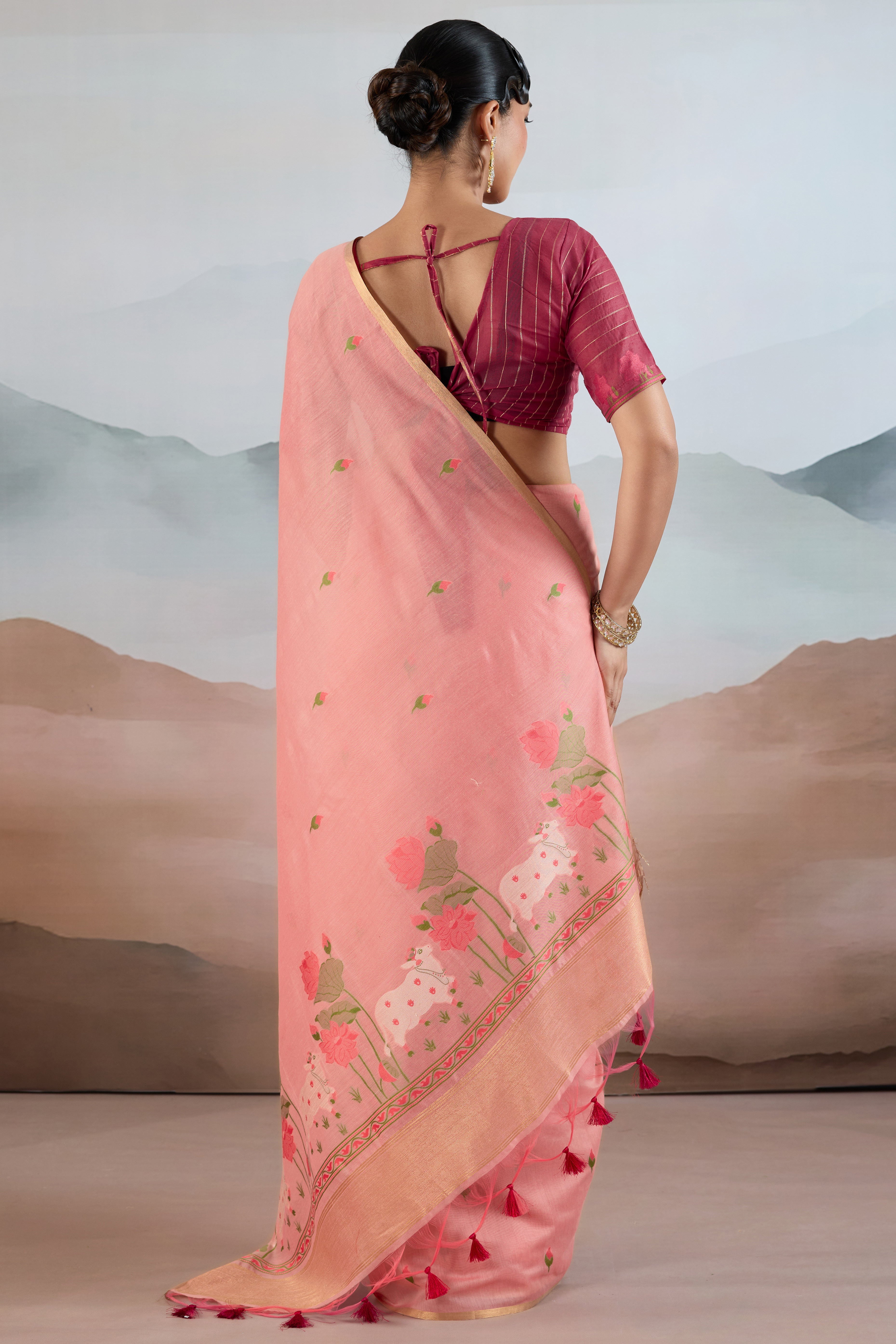 Trendy Peach Cotton Blend Weaving Saree Showcasing Floral & Animal Motif & Classic Tassel Pallu