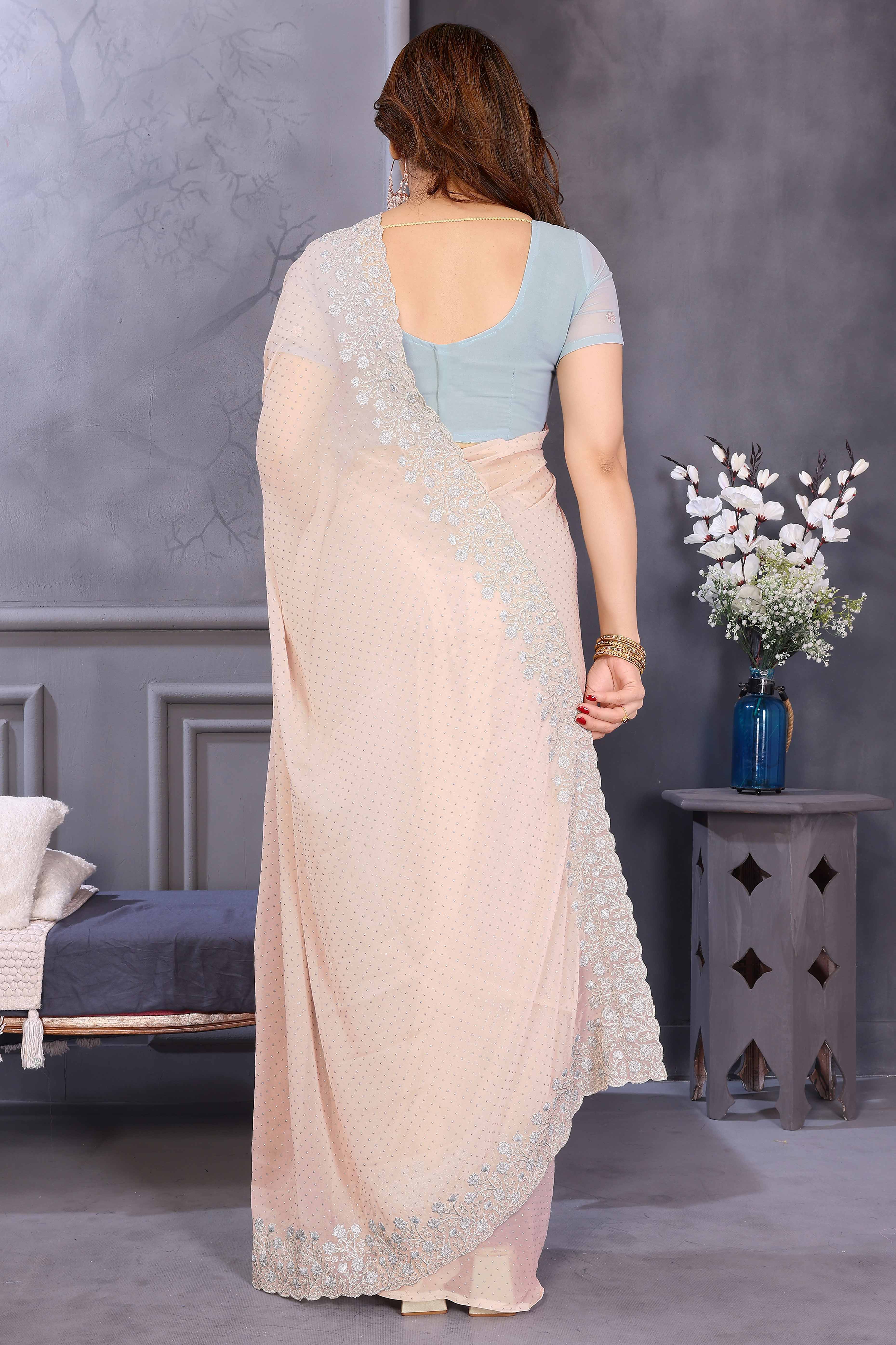 Soft Peach Georgette Saree with Subtle Zari Embroidery