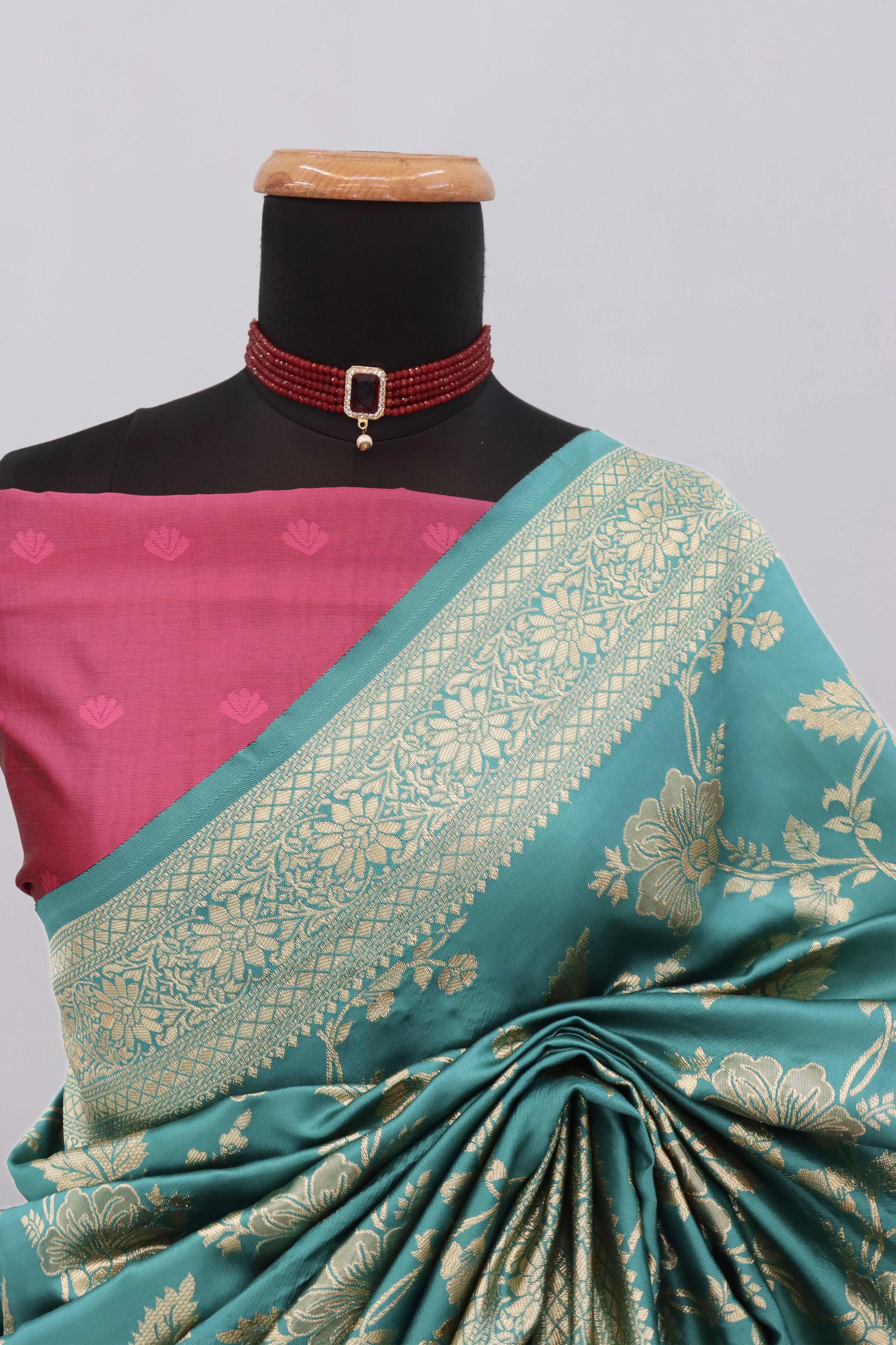 Graceful Rama Blue & Pink Banarasi Silk Saree Featuring Intricate Floral Zari Weaving Work