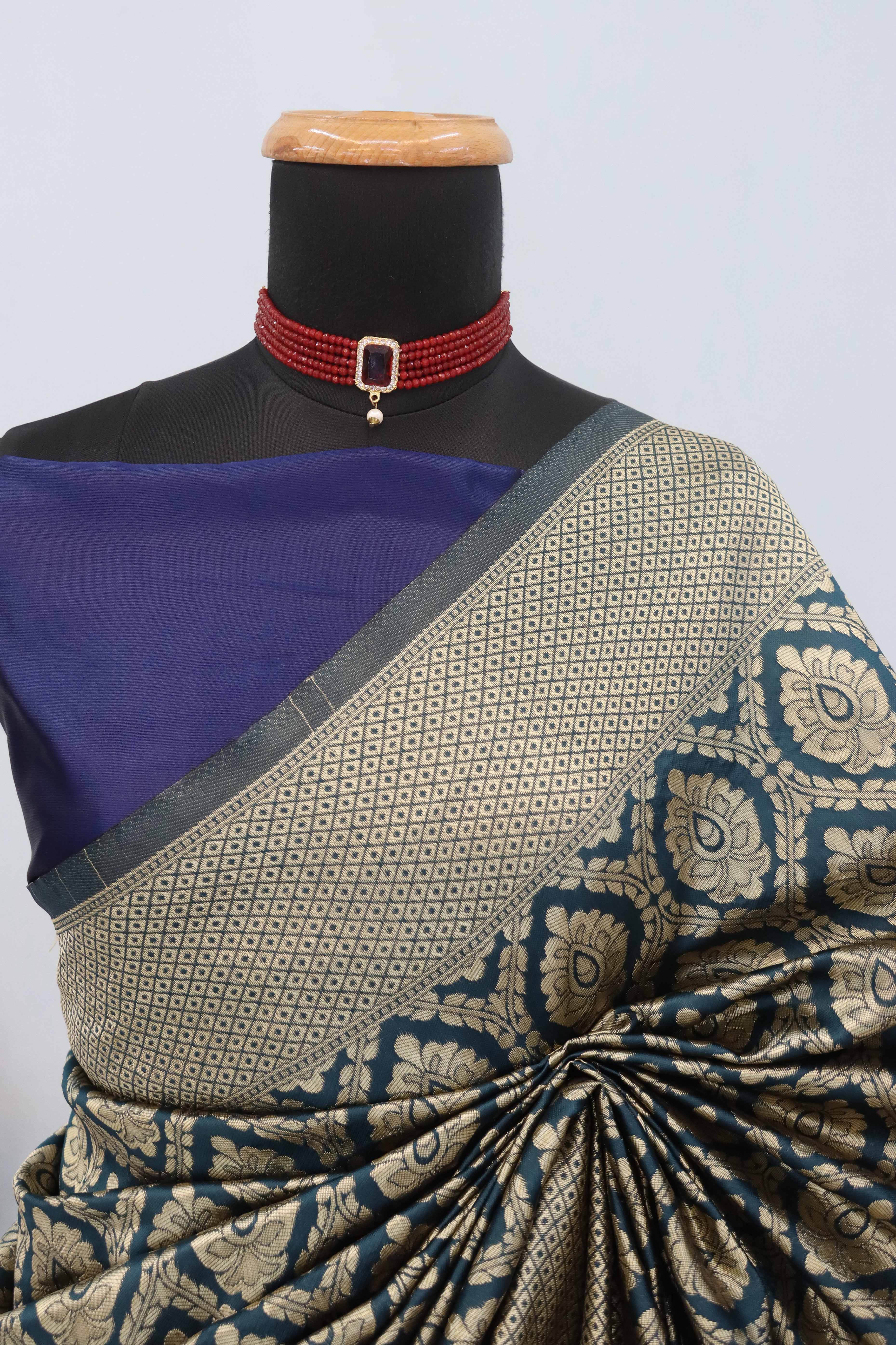 Charming Dark Teal Banarasi Silk Saree Adorned With Floral Zari Weaving