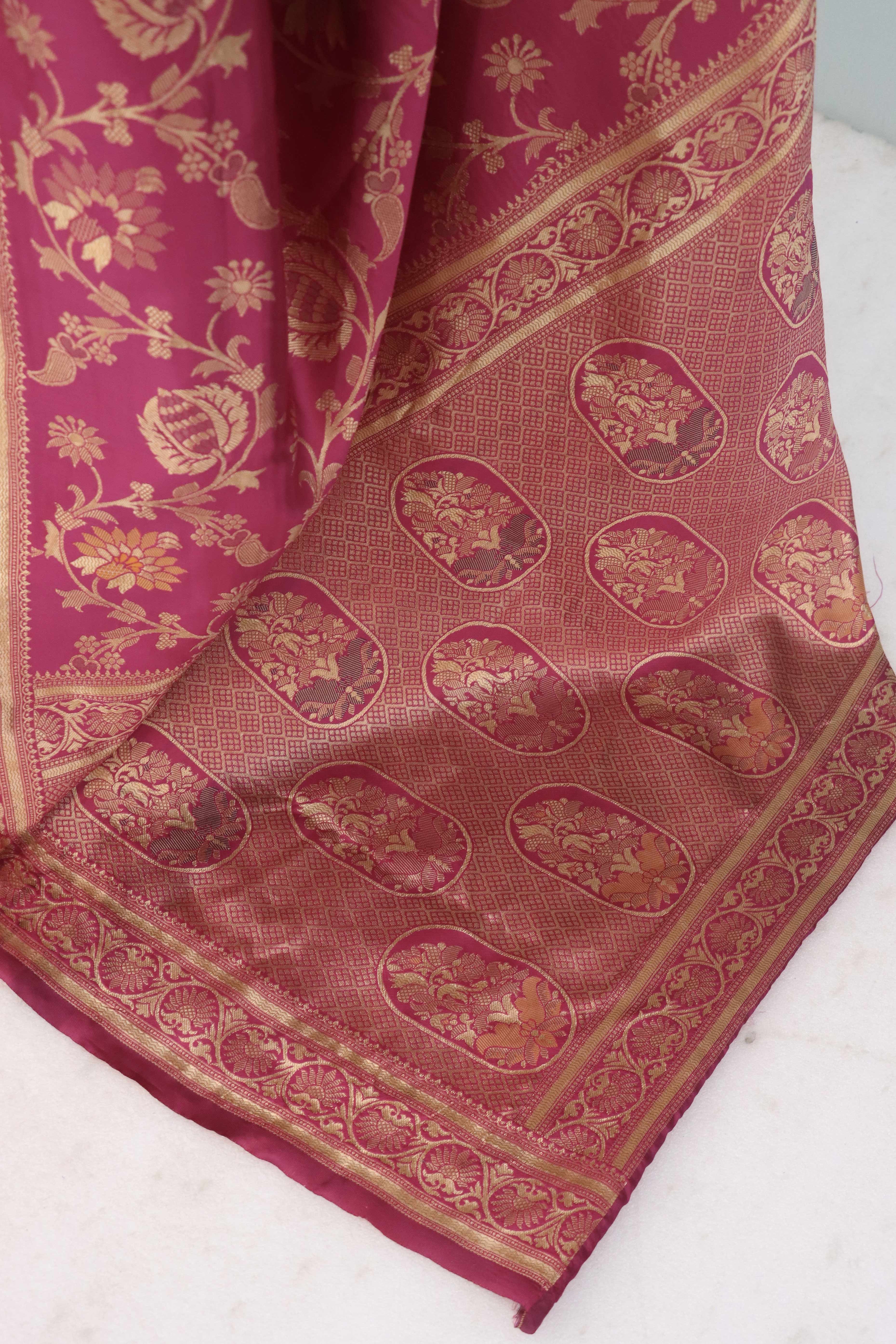 Charming Rani Pink Banarasi Silk Saree Adorned With Floral Zari Weaving