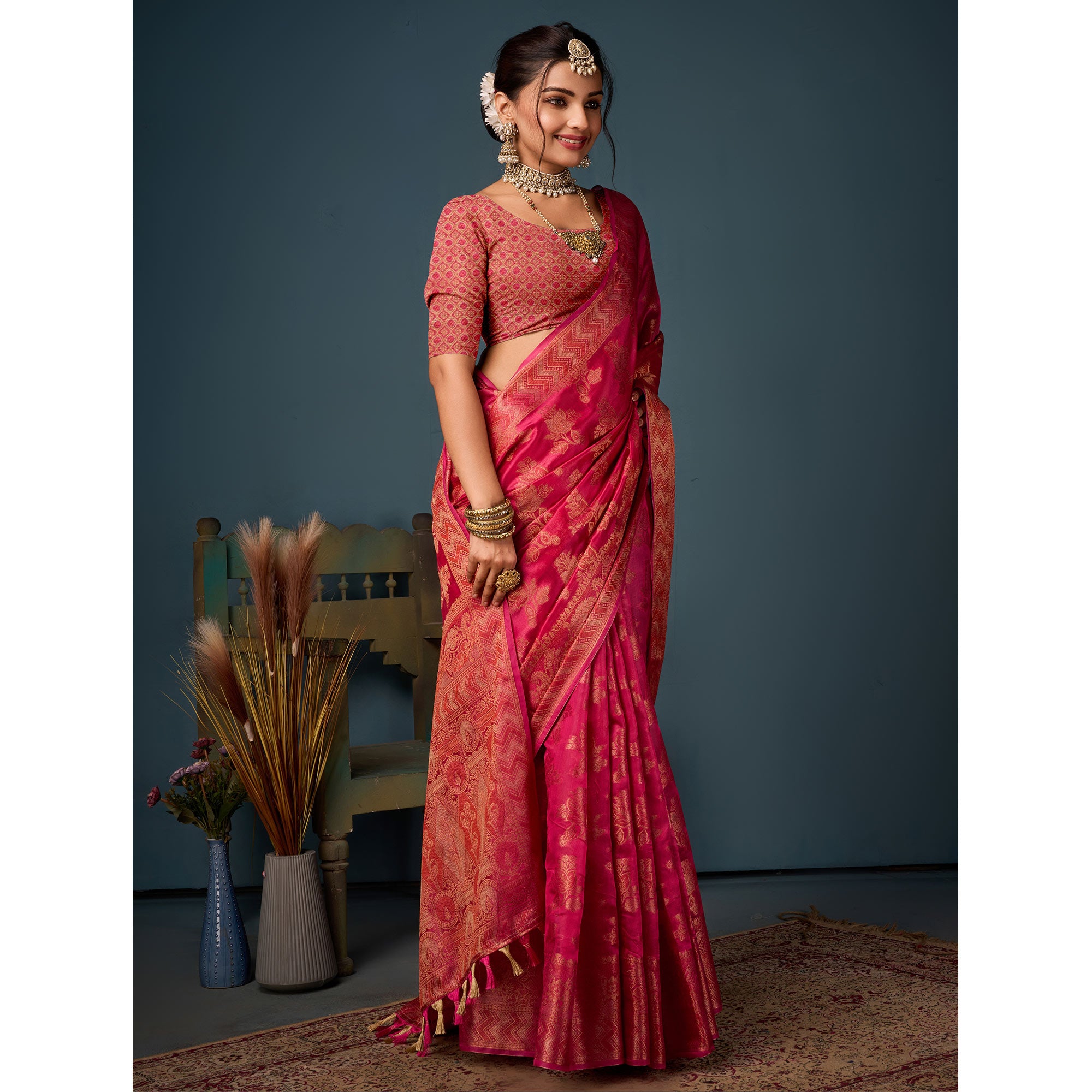 Rani Pink Floral Woven Organza Saree With Tassels