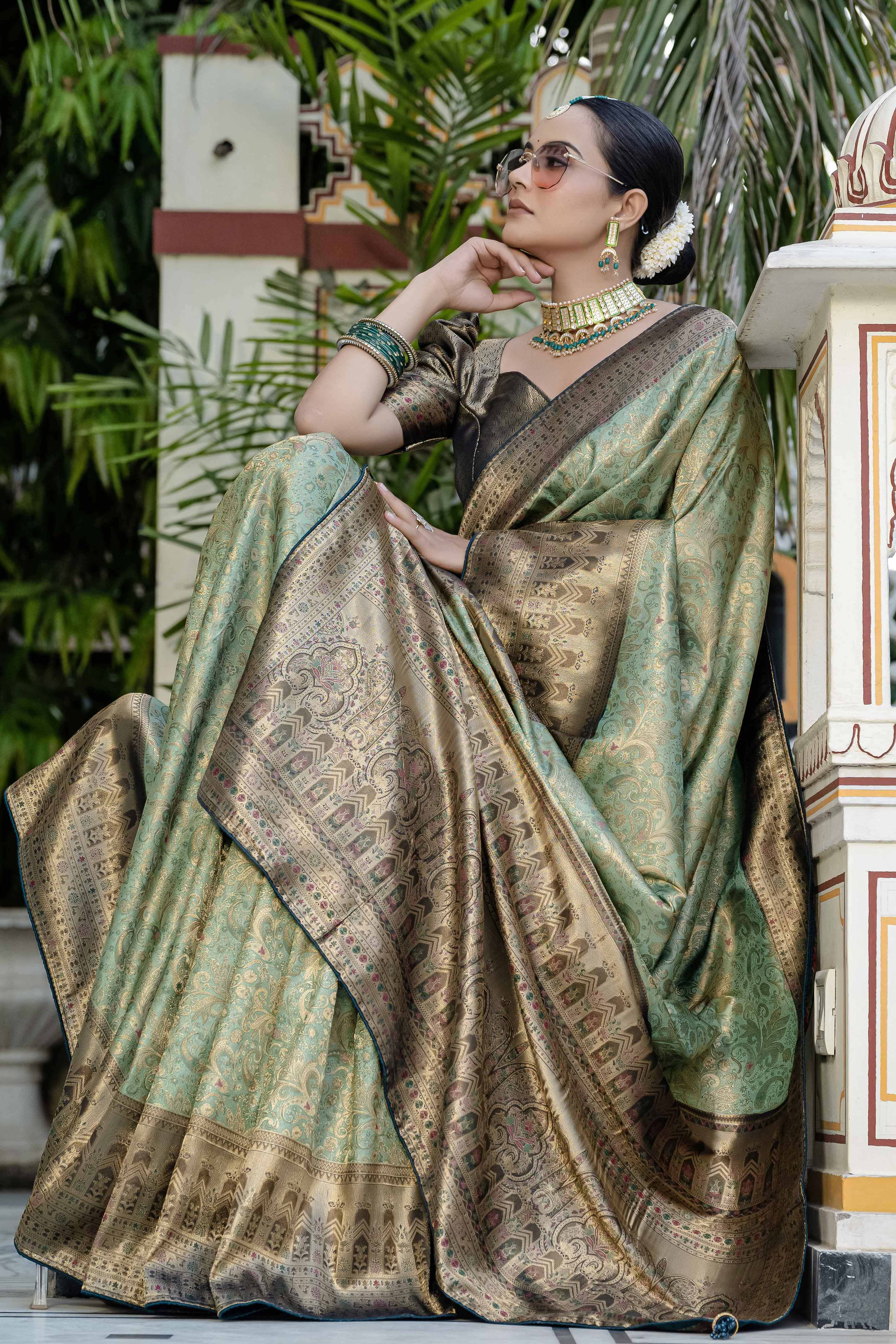 Green Kanjivaram Silk Saree Showcasing Floral Meenakari Zari Weaving With Elegant Piping & Tassels
