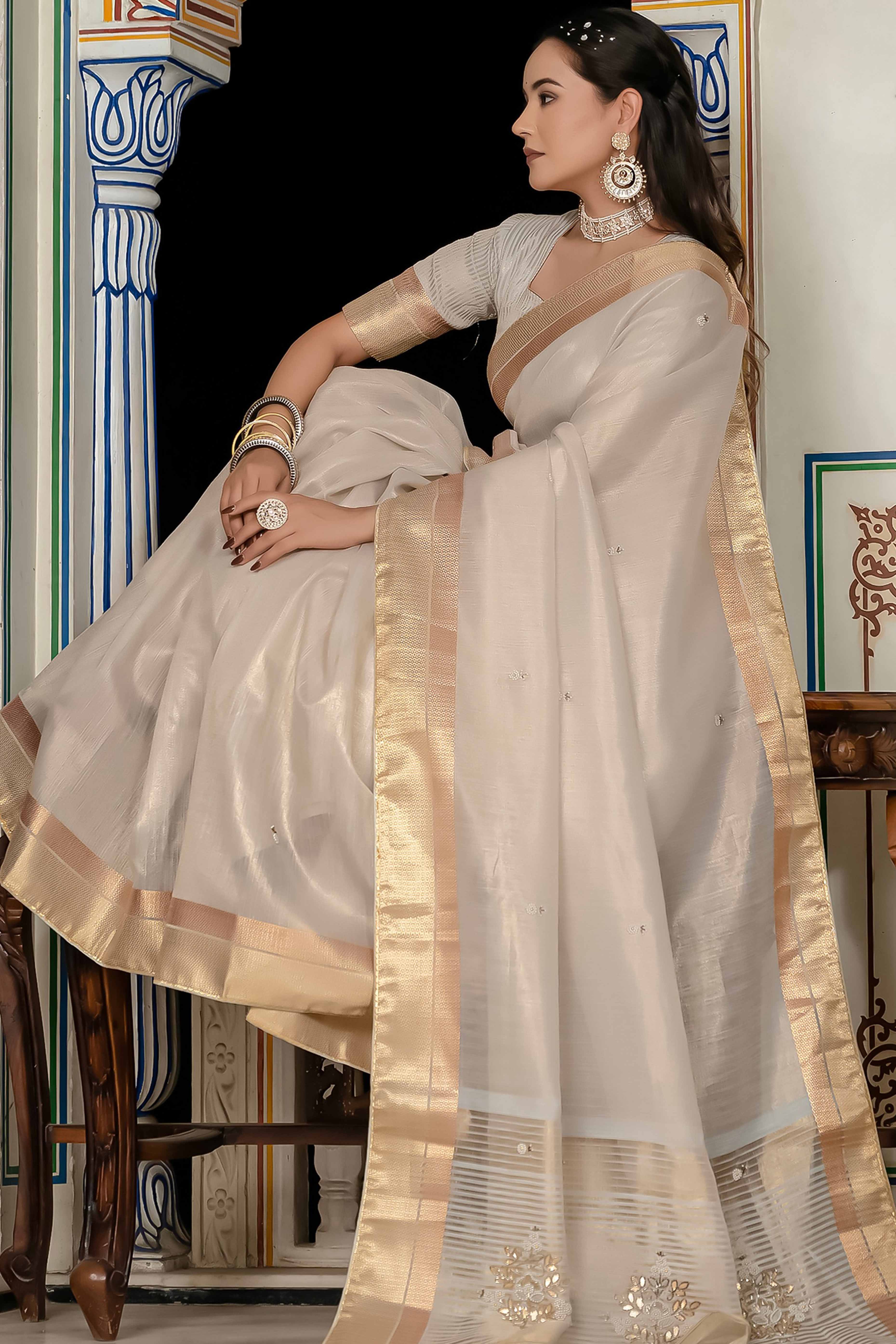 Off White Tissue Linen Saree Featuring Intricate Zari and Beadwork