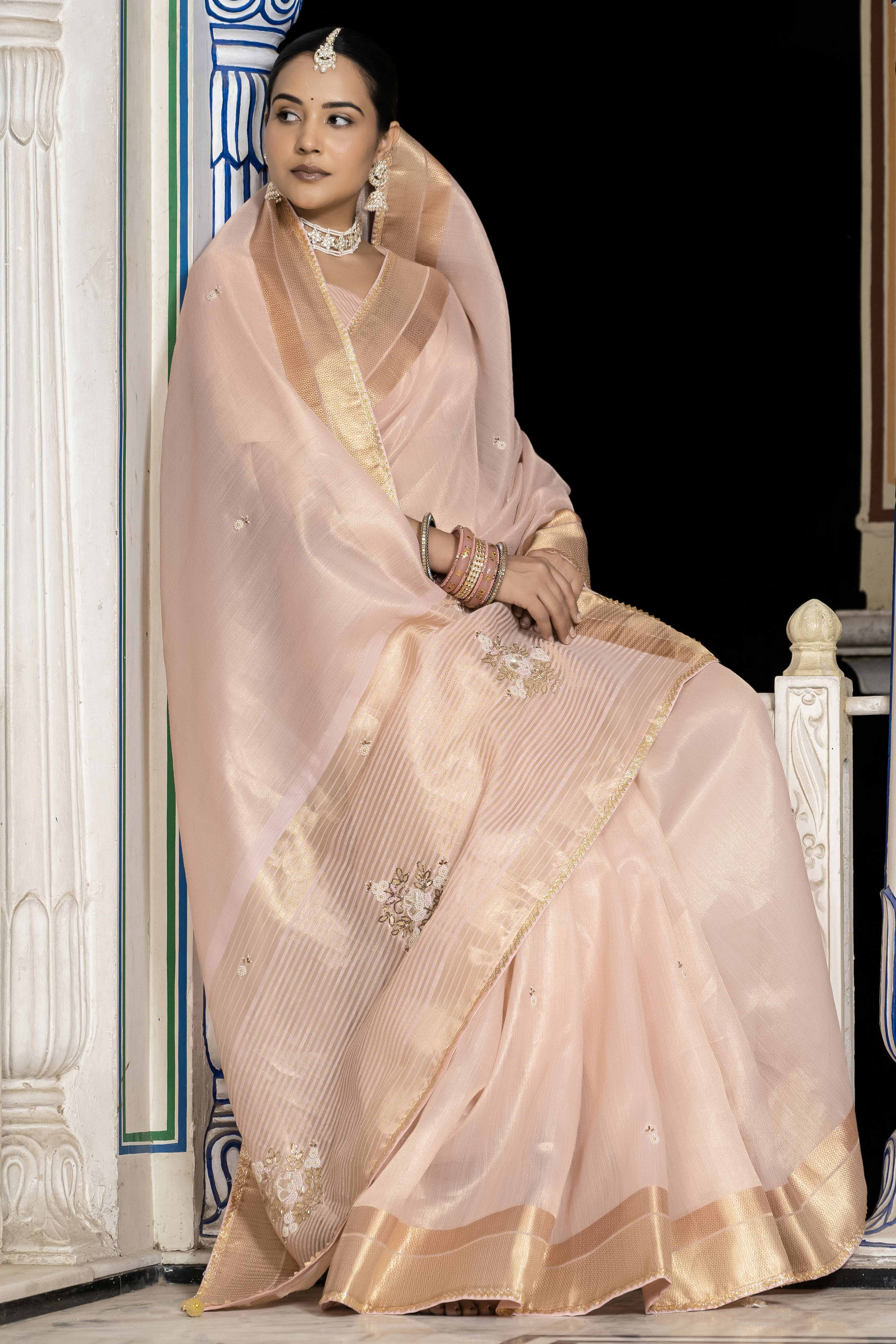 Pink Tissue Linen Saree Featuring Intricate Zari and Beadwork