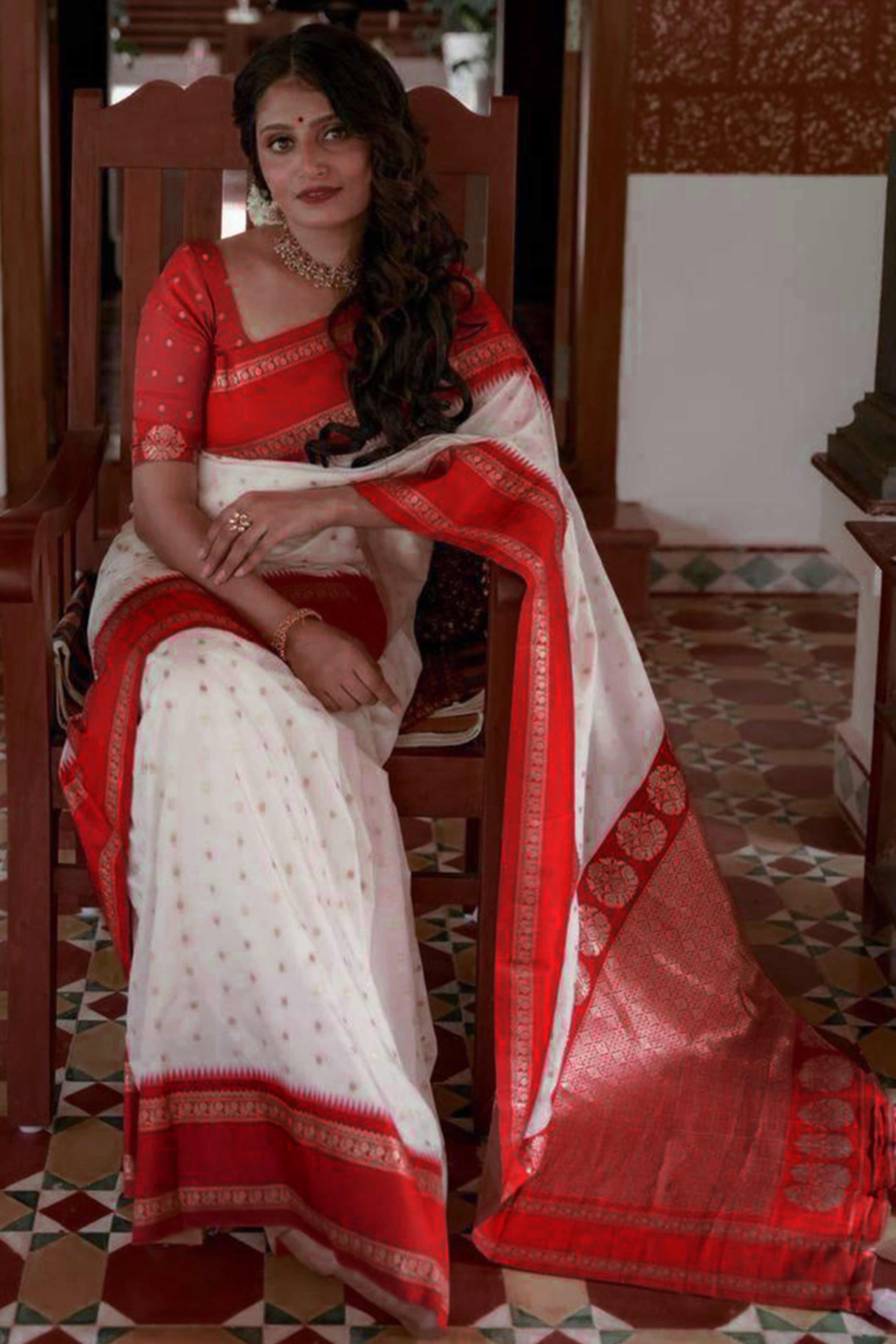 Graceful White & Red Zari Woven Lichi Banarasi Silk Saree With Tassel Accents