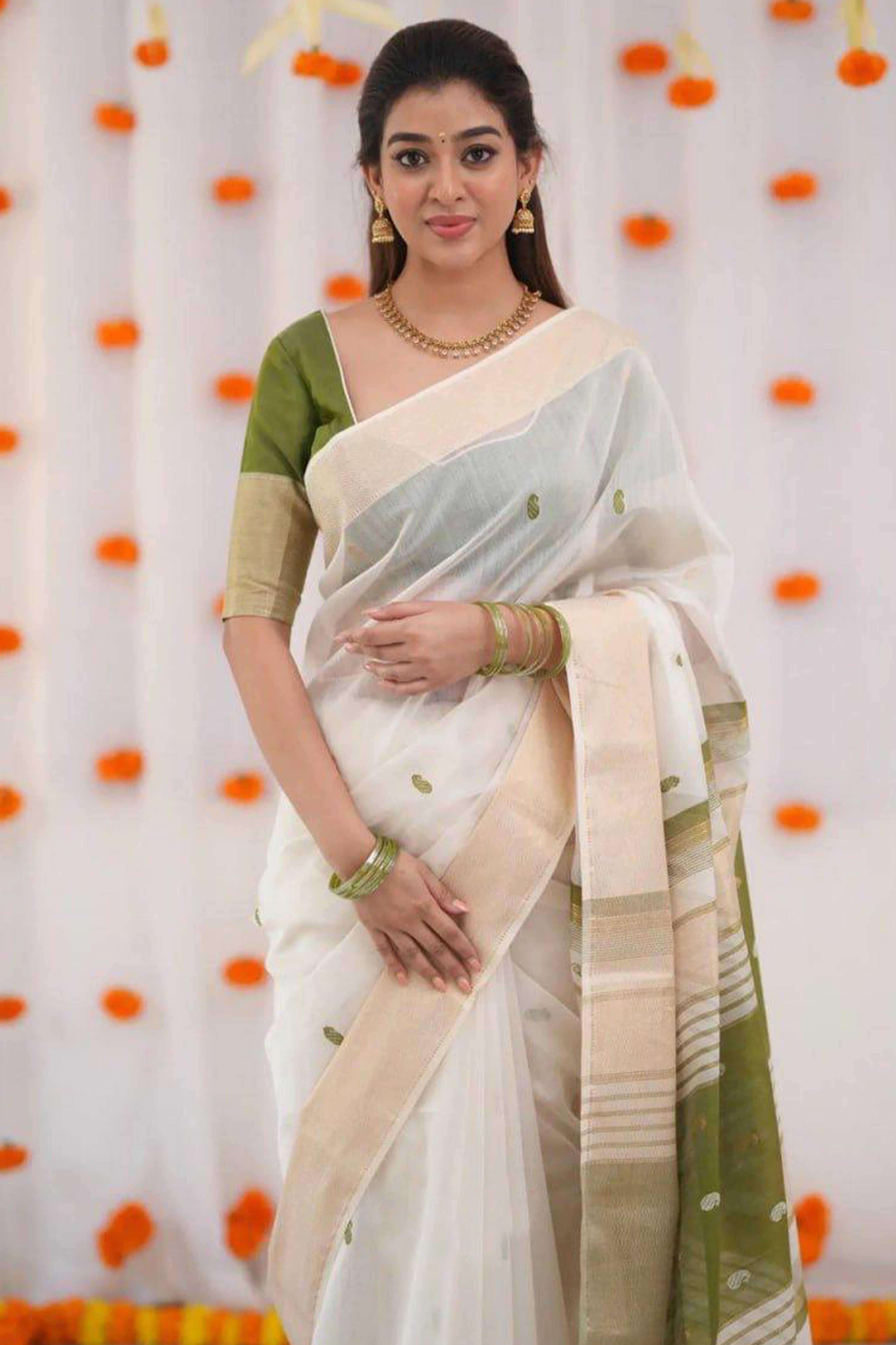 White and Green Zari-Woven Linen Cotton Saree Offering a Refined Festive Look