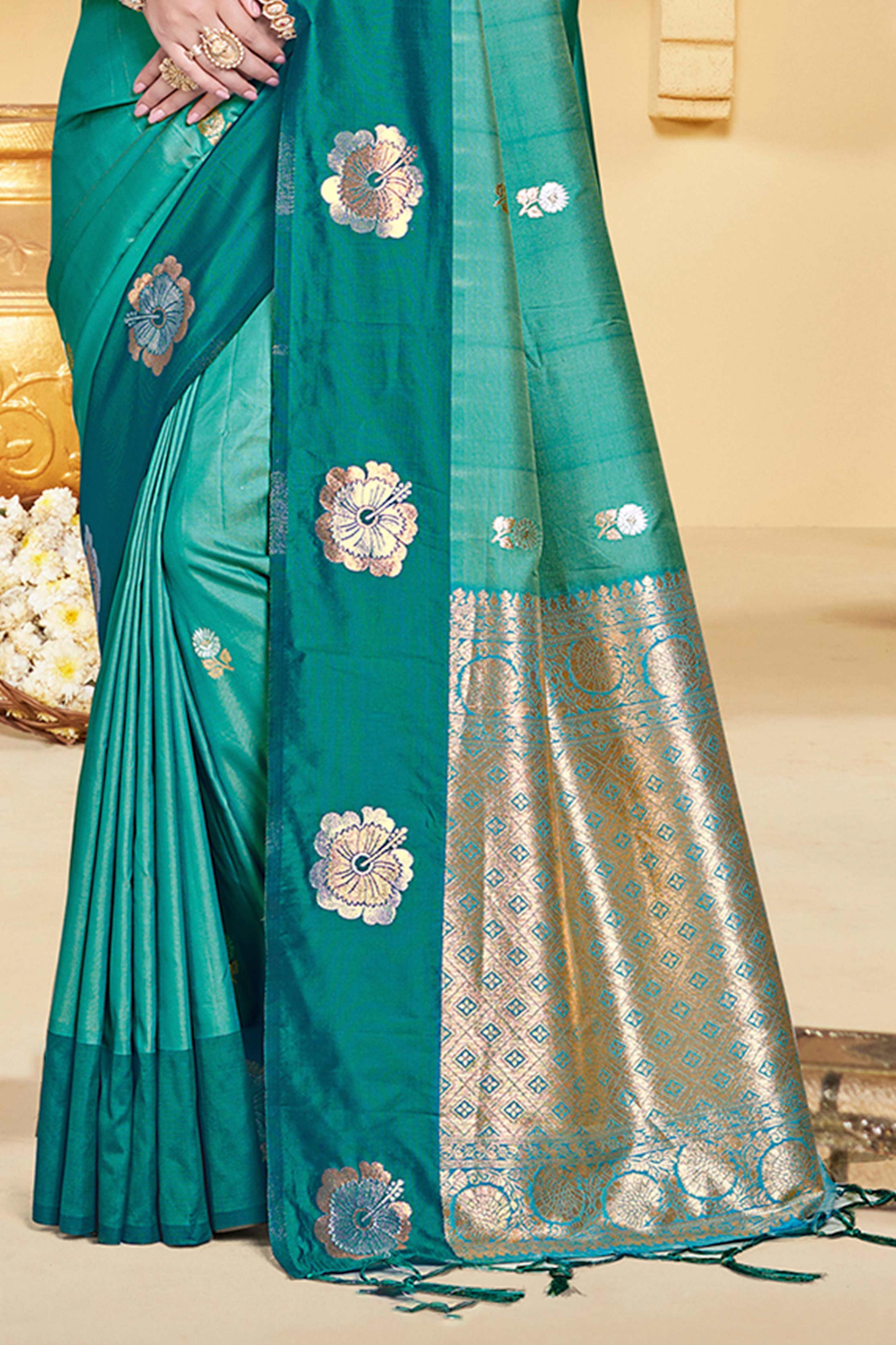 Charming Rama Green Floral Zari Weaving Silk Blend Saree Enhanced With Stylish Tassel Pallu