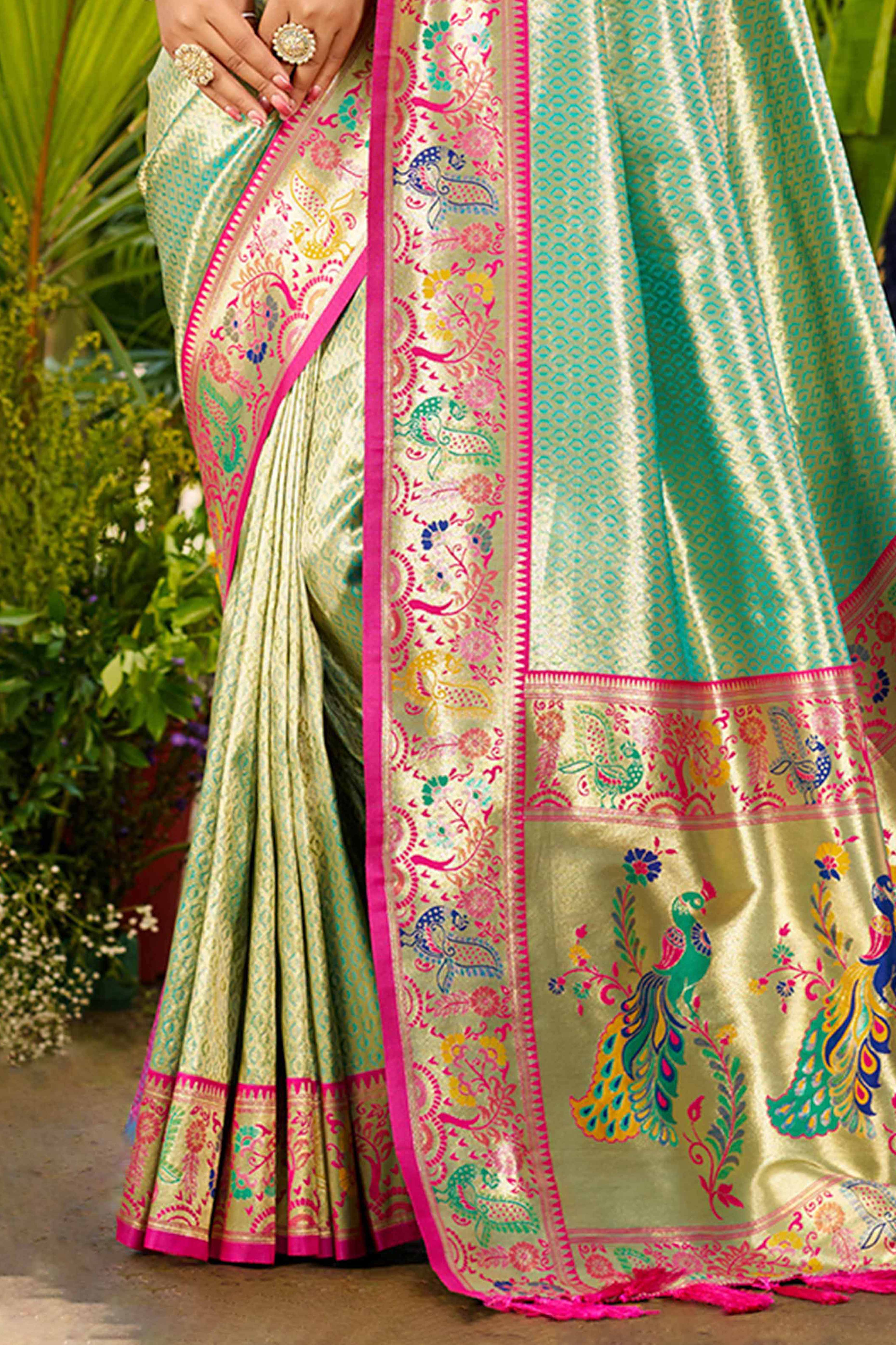 Graceful Turquoise Silk Blend Saree Adorned With Intricate Zari Weave & Peacock Motif Pallu