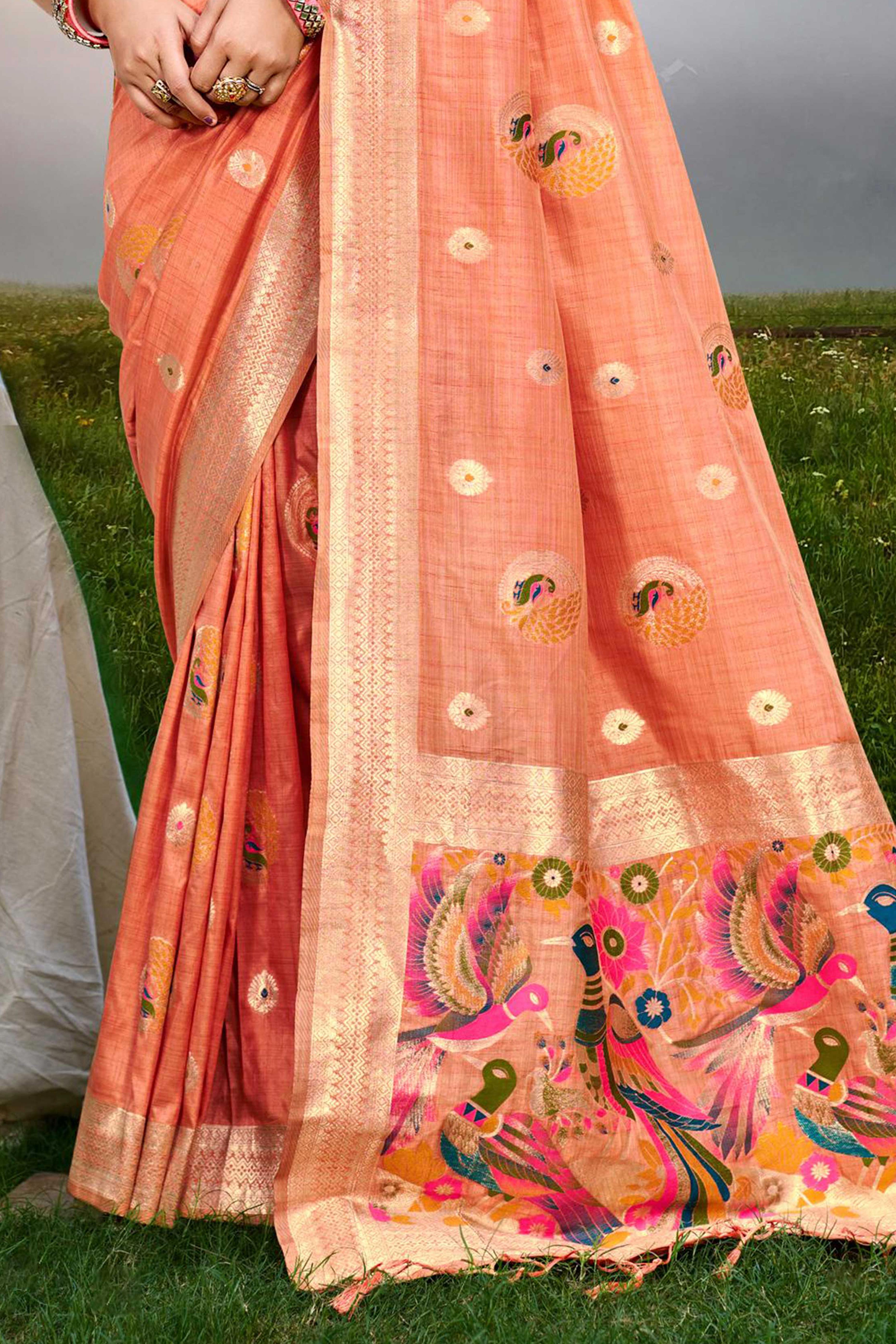 Designer Light Orange Assam Silk Blend Saree Adorned With Peacock Zari Weaving & Tassel Pallu