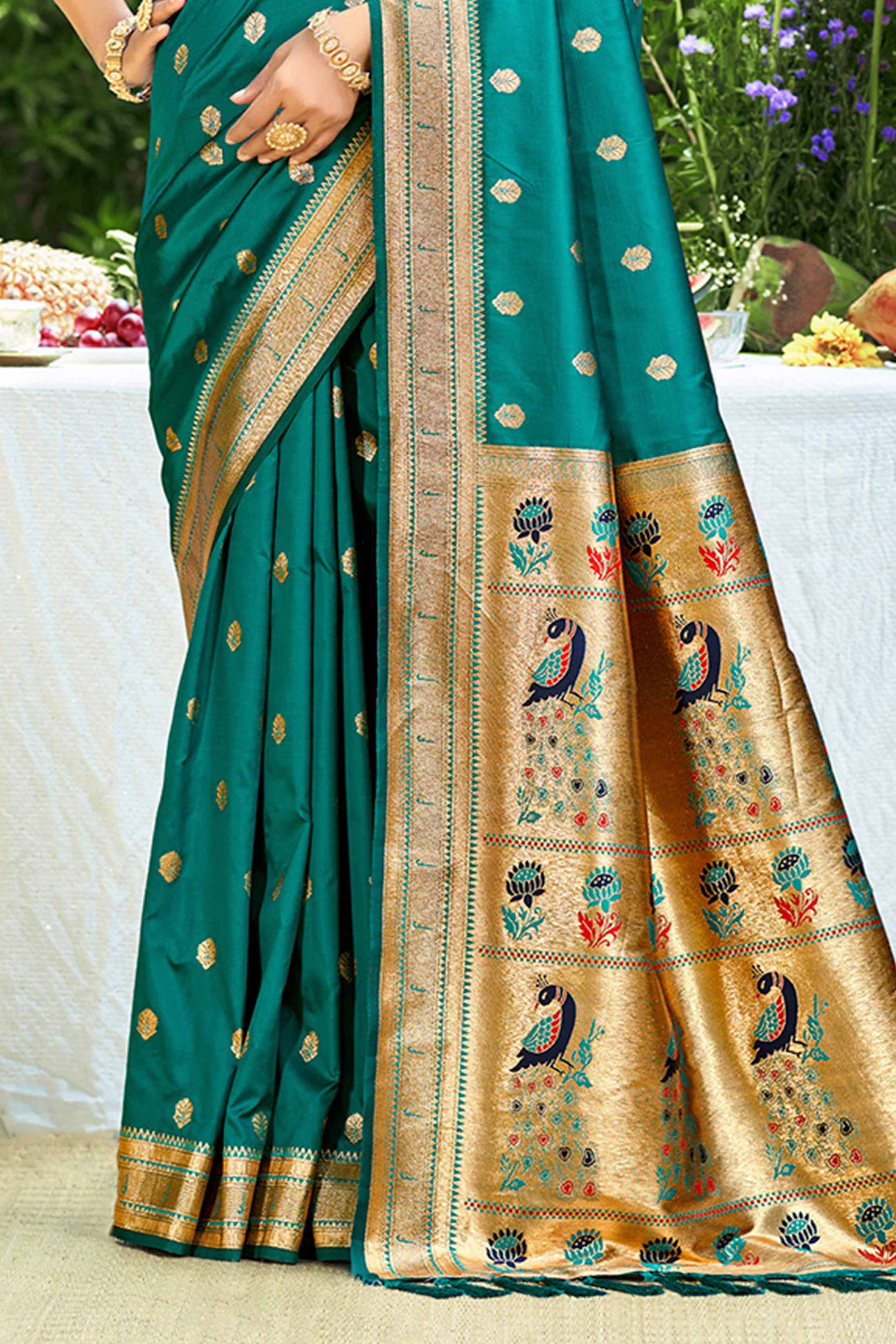 Teal Zari Weaving Silk Blend Saree Adorned With Intricate Peacock Motif Pallu & Graceful Tassel