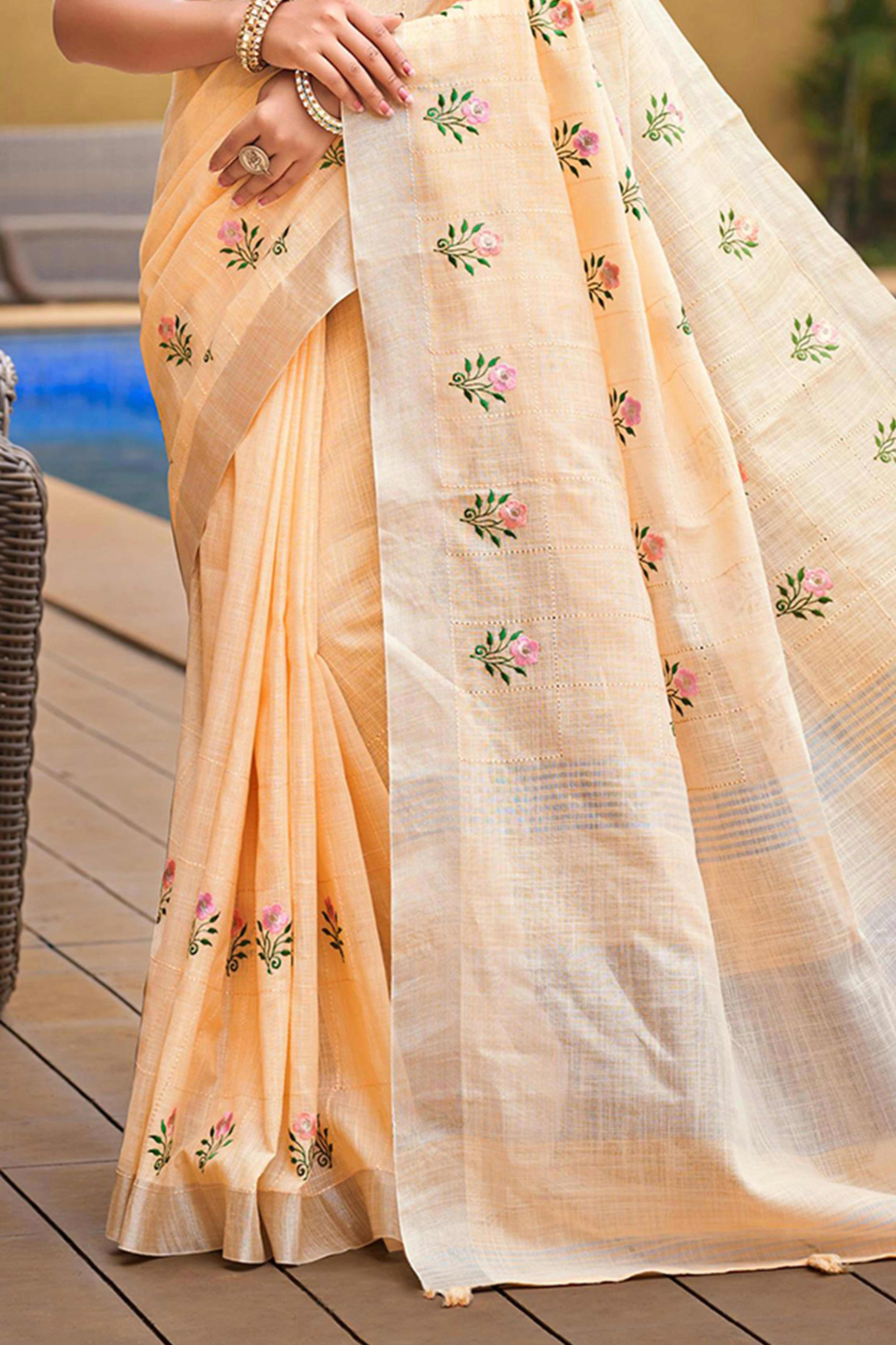 Captivating Light Peach Floral Thread Embroidered Linen Saree With Elegant Weaving Border