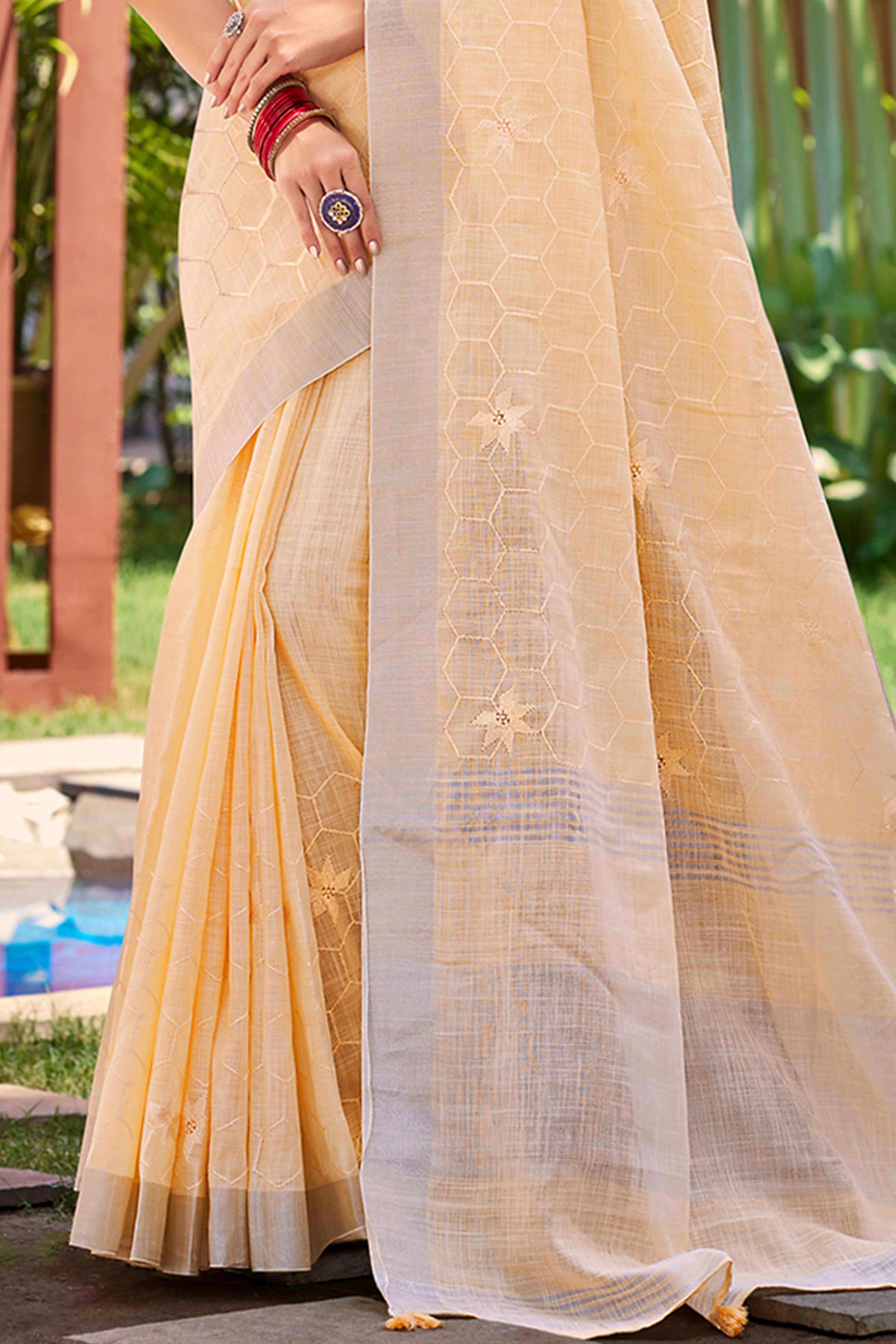 Light Peach Classic Linen Saree Enhanced With Fine Geometric Embroidery Work & Tassel Pallu