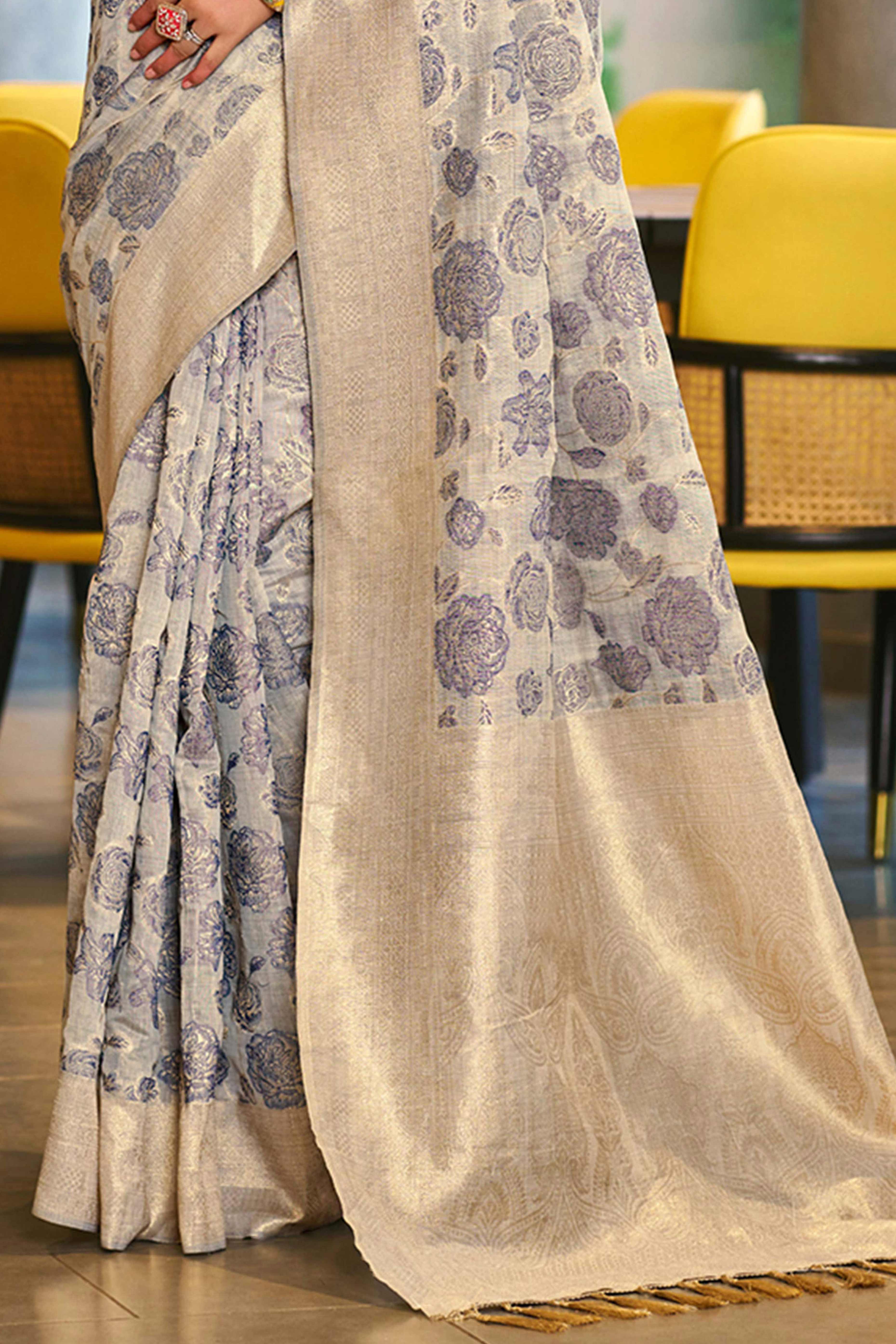 Grey Premium Cotton Silk Saree Highlighted With Floral Weaving Work & Tassel Pallu