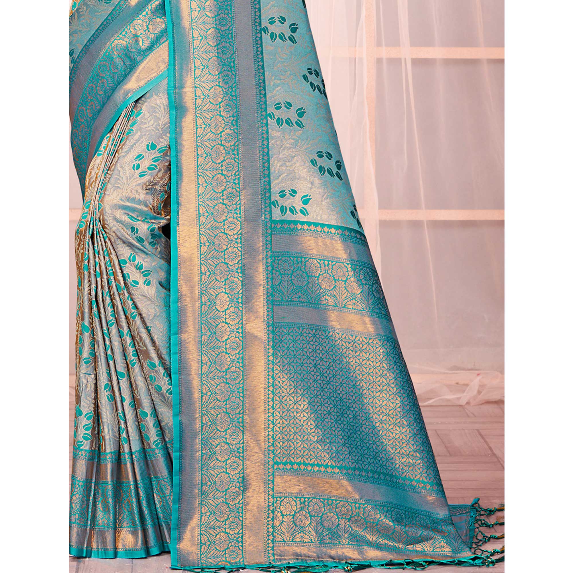 Turquoise Floral Woven Kanjivaram Silk Saree With Tassels