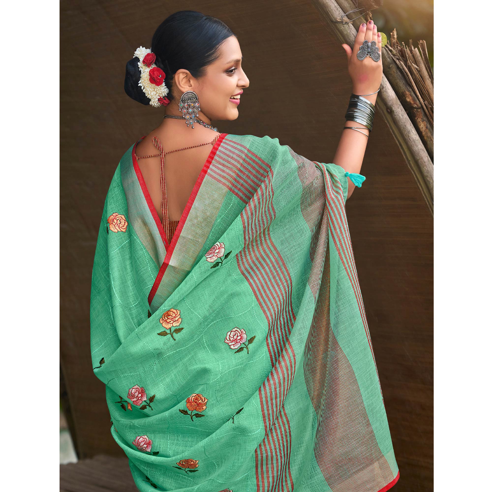 Sea Green Floral Embroidered Linen Saree With Tassels