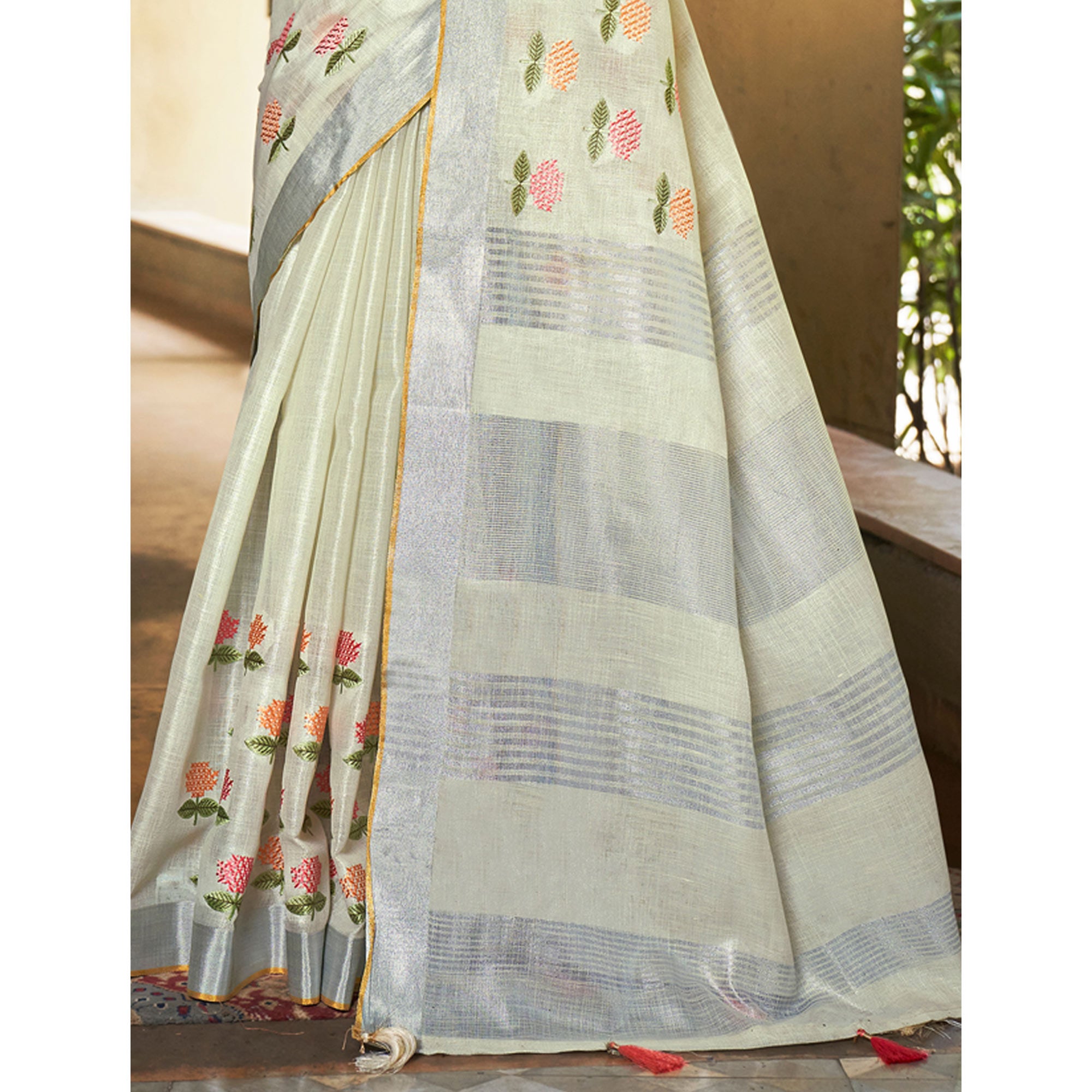 Pale Yellow Floral Embroidered Linen Saree With Tassels