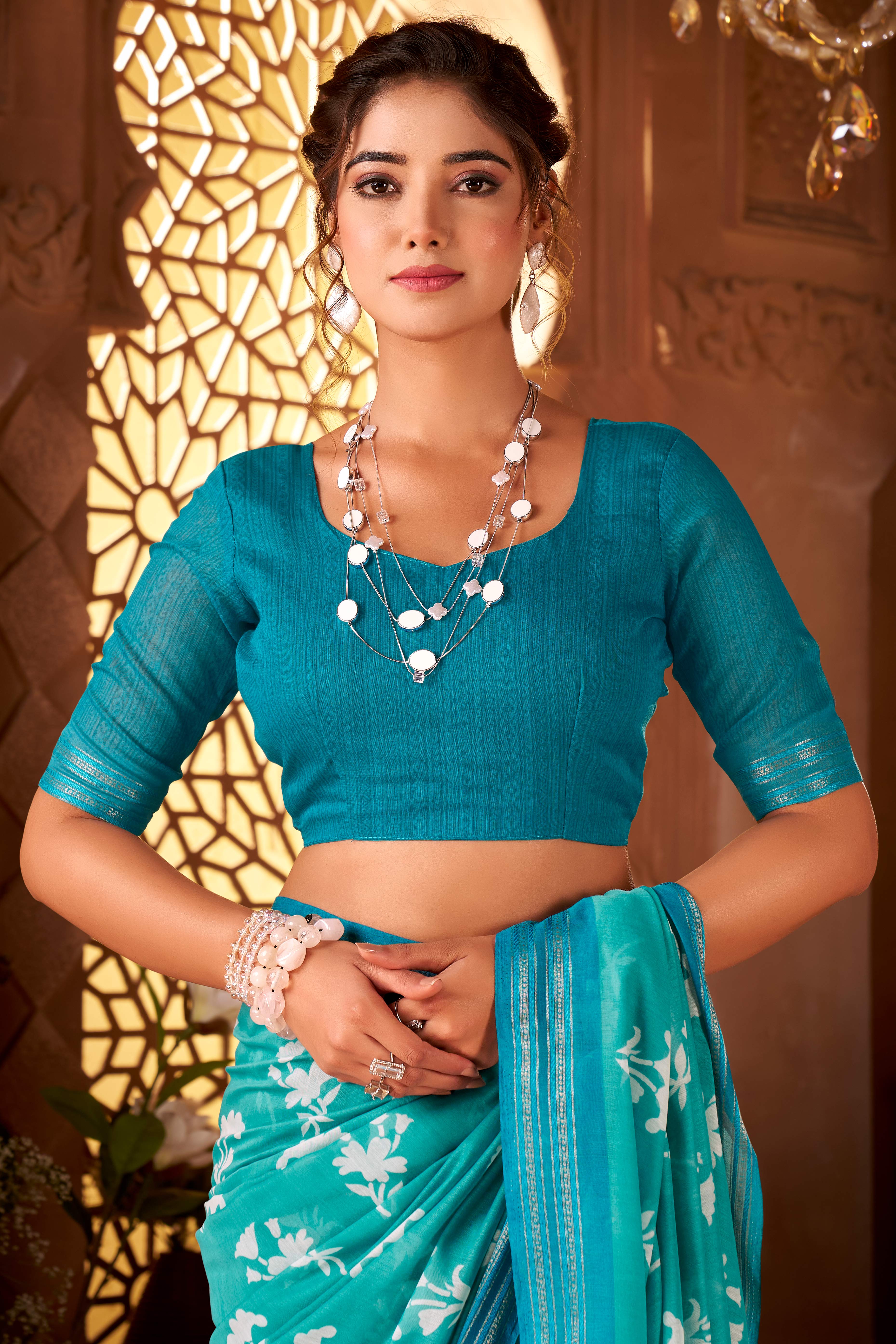 Sophisticated Turquoise Mulmul Cotton Saree Featuring Delicate Floral Prints & Weaving Border
