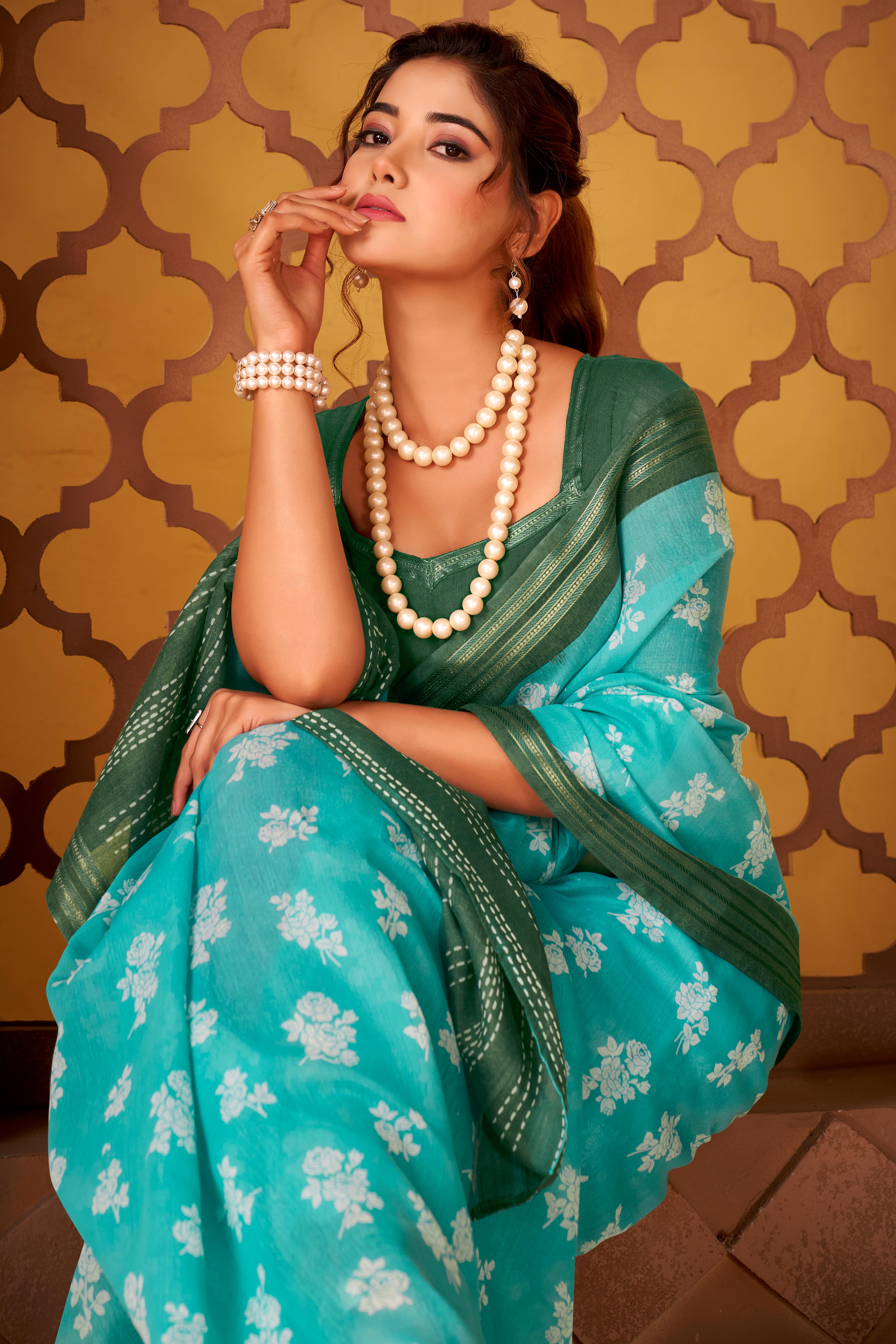 Sophisticated Turquoise Mulmul Cotton Saree Featuring Delicate Floral Prints & Weaving Border