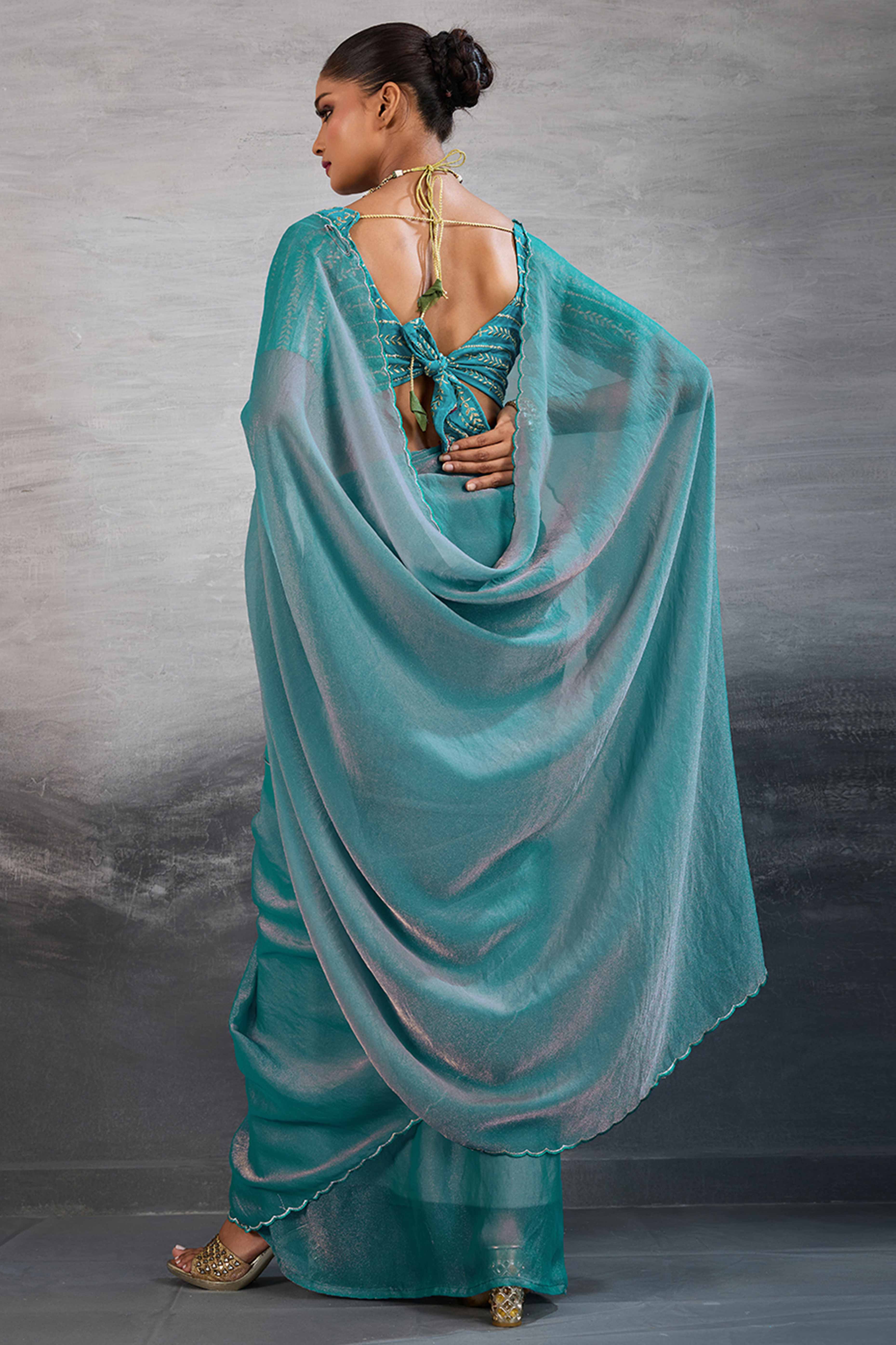 Turquoise Solid Organza Jimmy Choo Saree Accentuated With Elegant Cutwork Border Detailing