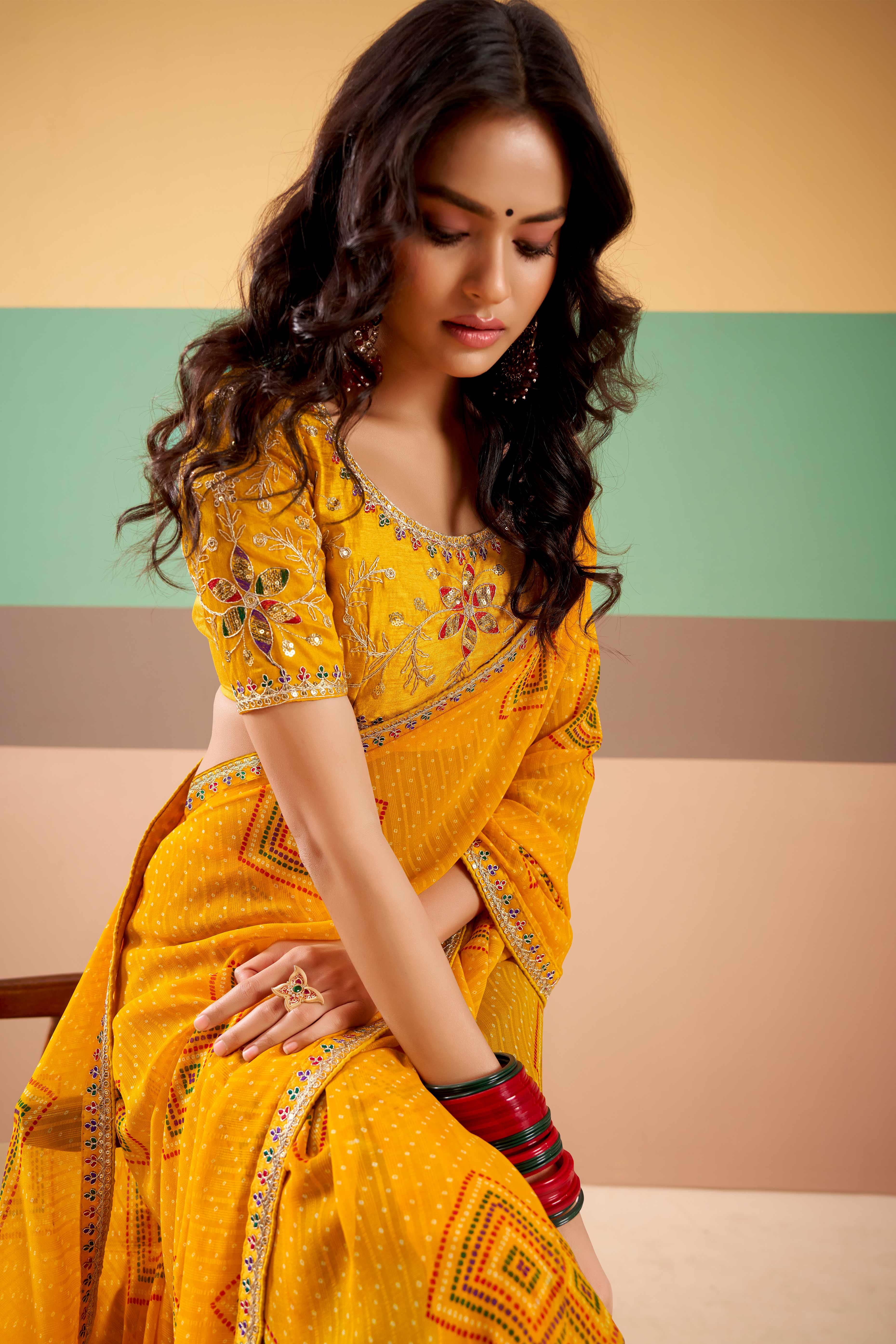 Charming Mustard Bandhani Printed Georgette Saree Adorned With Cording Embroidered Border