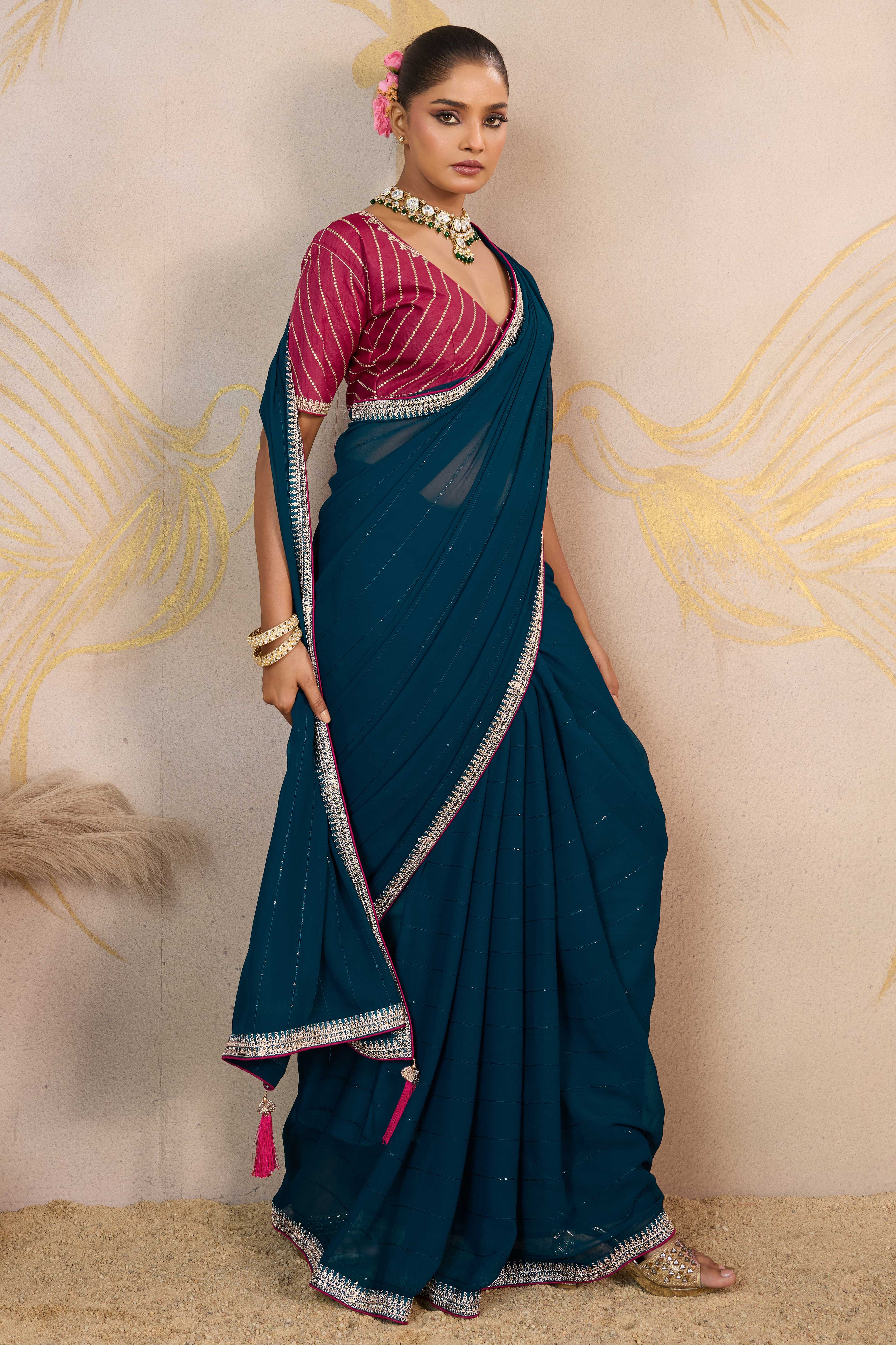 Teal Zari Embroidered Georgette Saree Accented With Sequins