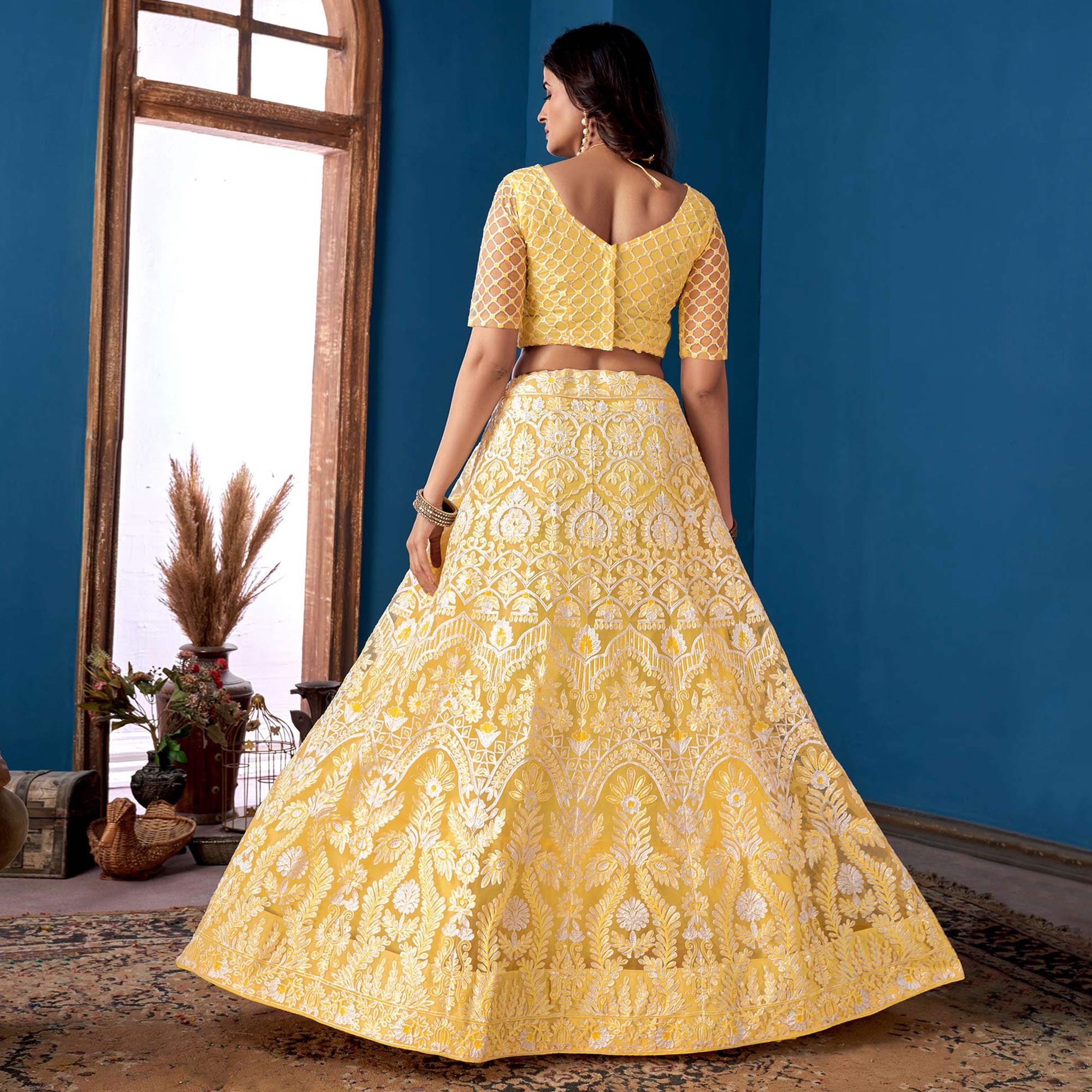 Yellow Floral Sequins Embroidered Net Lehenga Choli