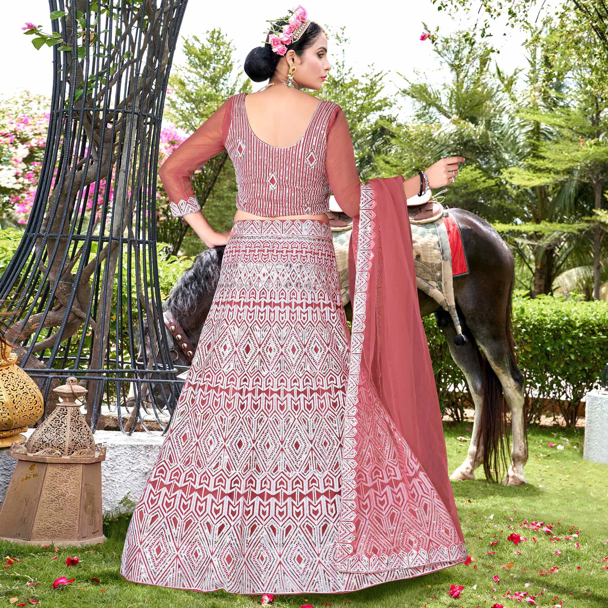 Rust Sequins Embroidered Net Semi Stitched Lehenga Choli