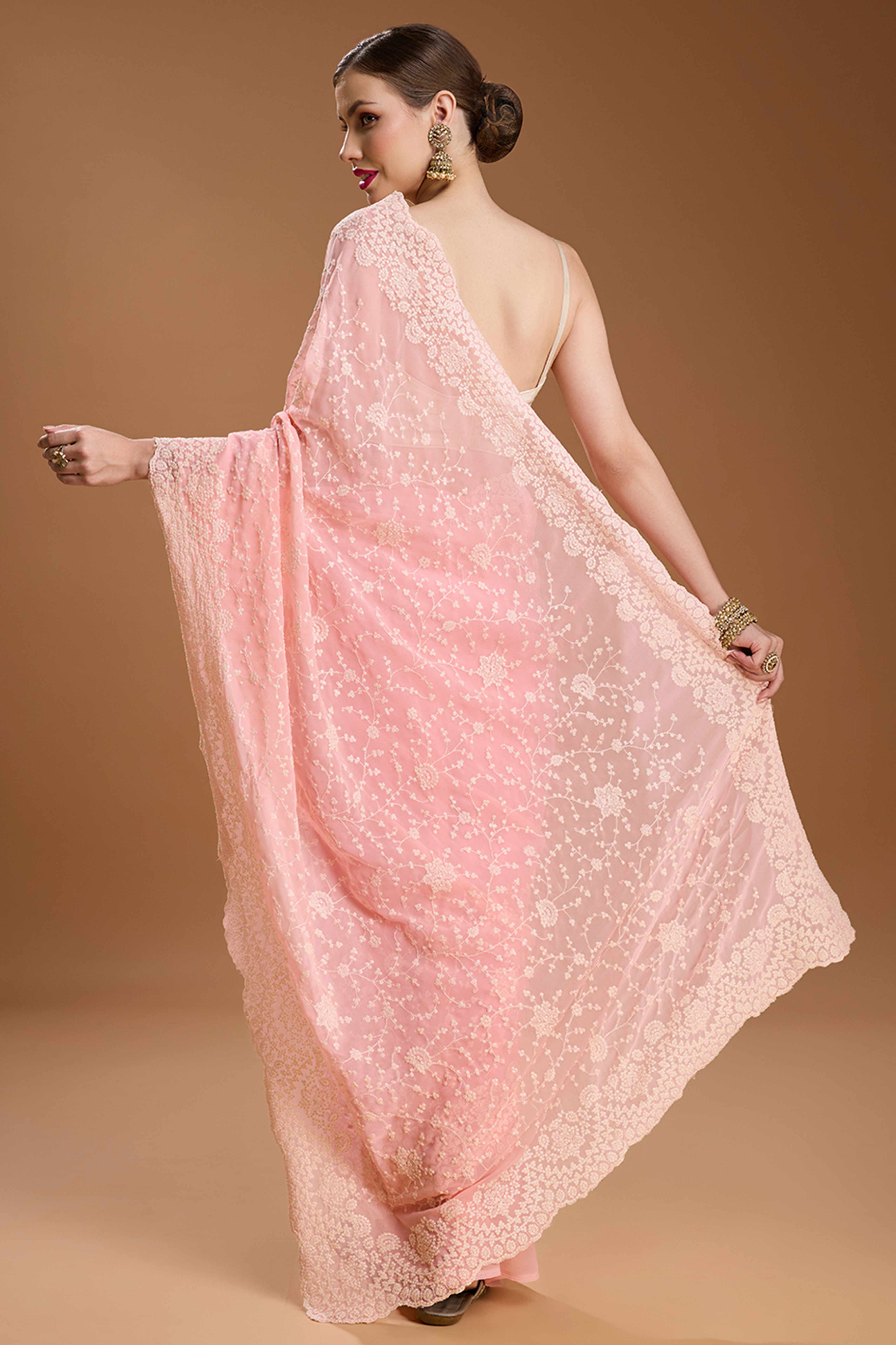 Soft Pastel Pink Embroidered Georgette Saree Featuring Thread Detailing